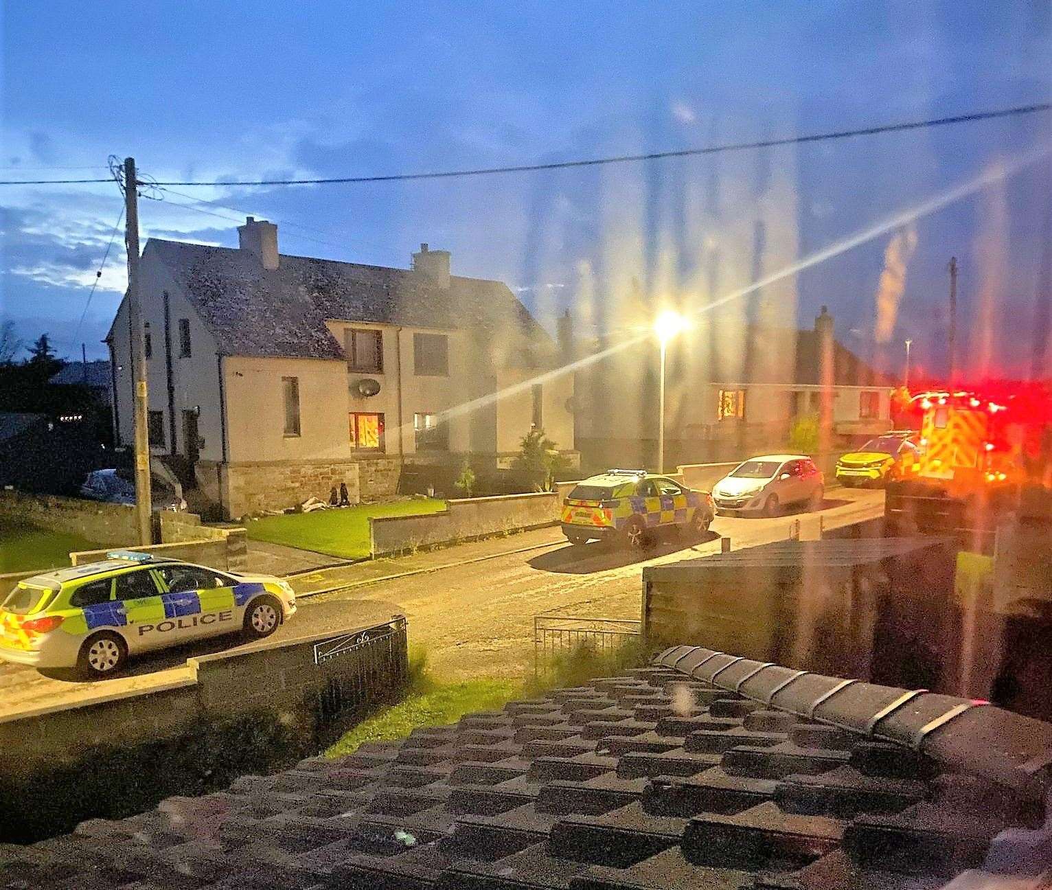 The scene at Robertson Crescent in Keiss as police investigations got underway after a 74-year-old man was murdered on Sunday. Picture: Emma Fairweather