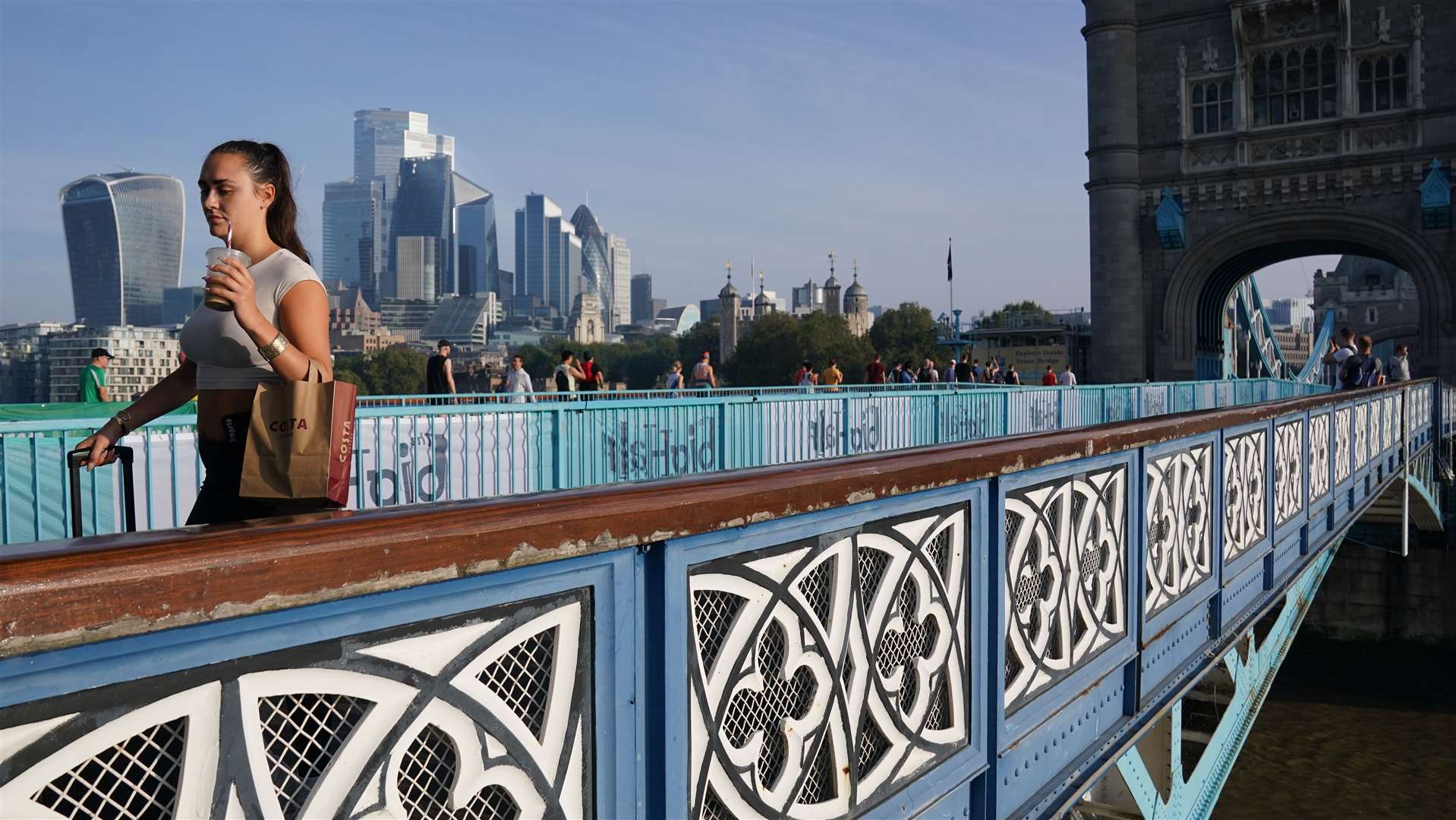 A woman walks along Tower Bridge in central London (Jonathan Brady/PA)