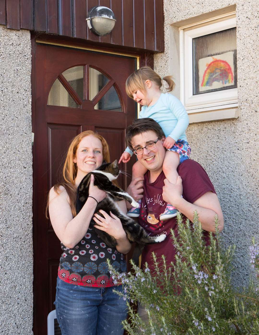 Photographer Alison and her family on her doorstep in Kinmylies.