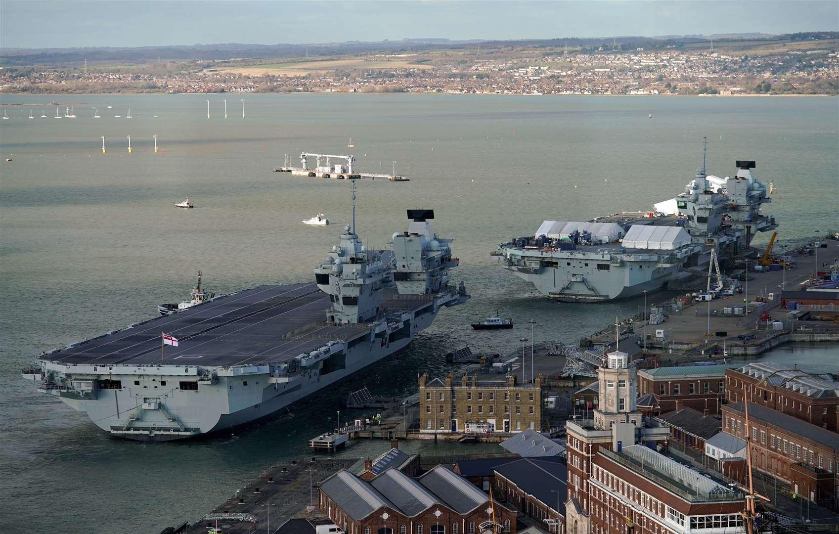 Aircraft carriers HMS Prince of Wales, left, and HMS Queen Elizabeth are currently alongside in Portsmouth (Andrew Matthews/PA)