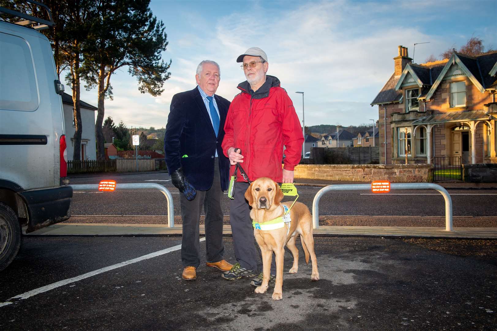 Councillor Bill Boyd with Rod Murchison and guide dog Innes.