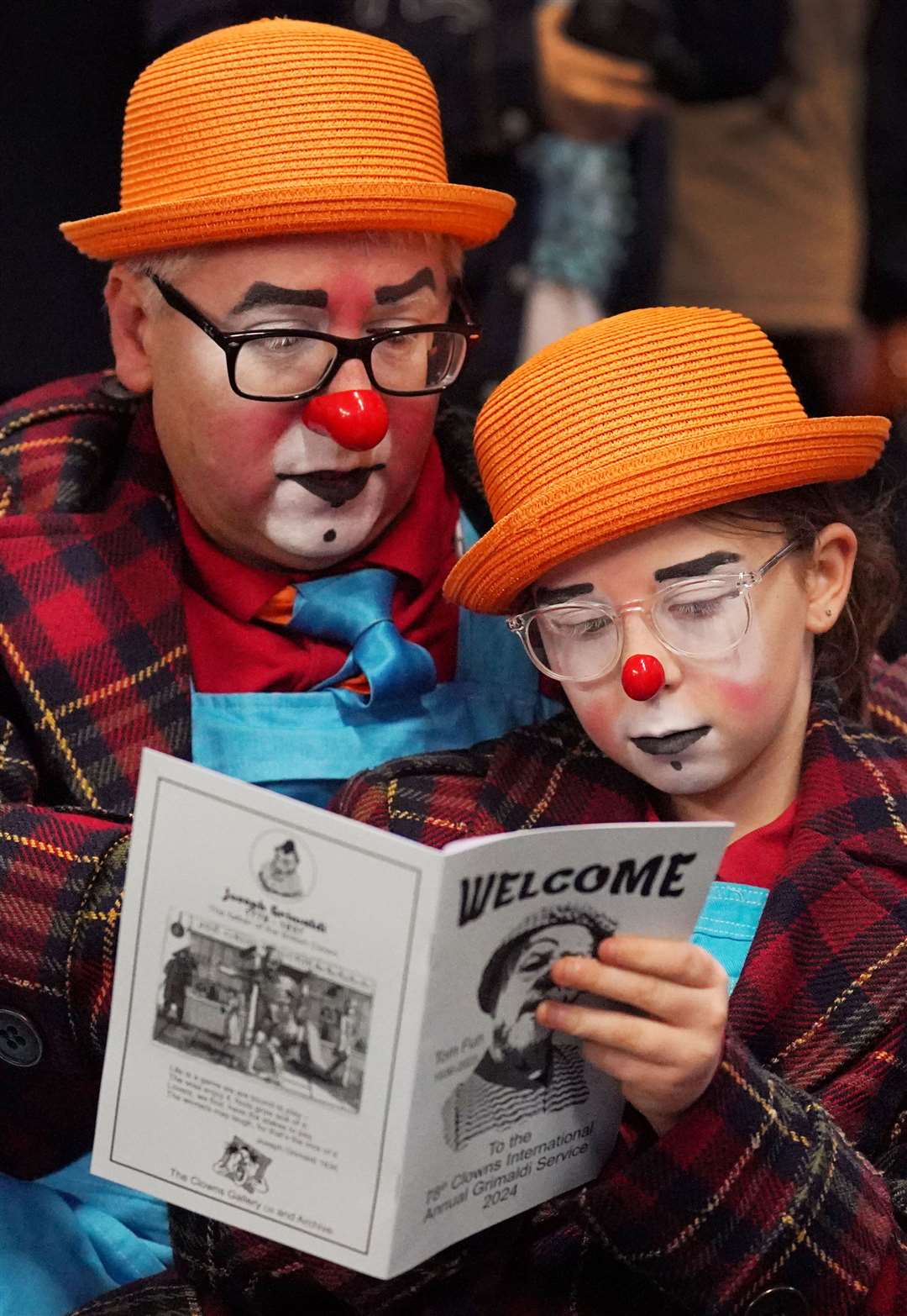 A pair of clowns wearing matching outfits (Jonathan Brady/PA)
