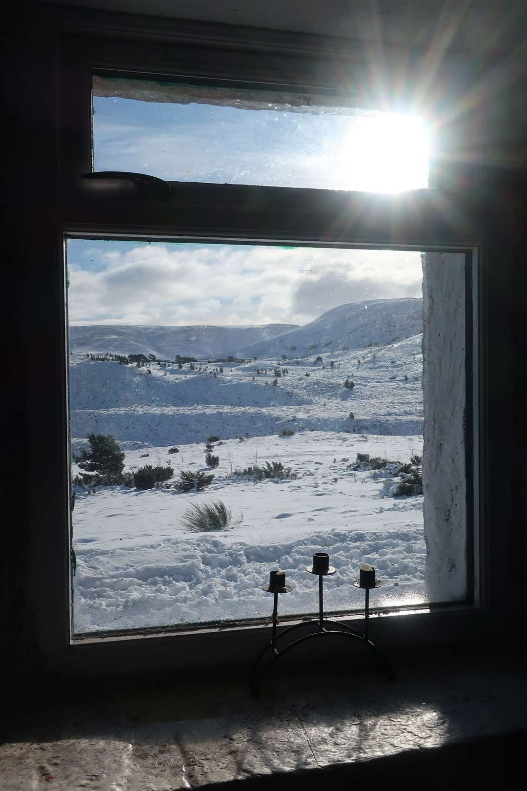 The view from the window of Ryvoan bothy on a winter's day.