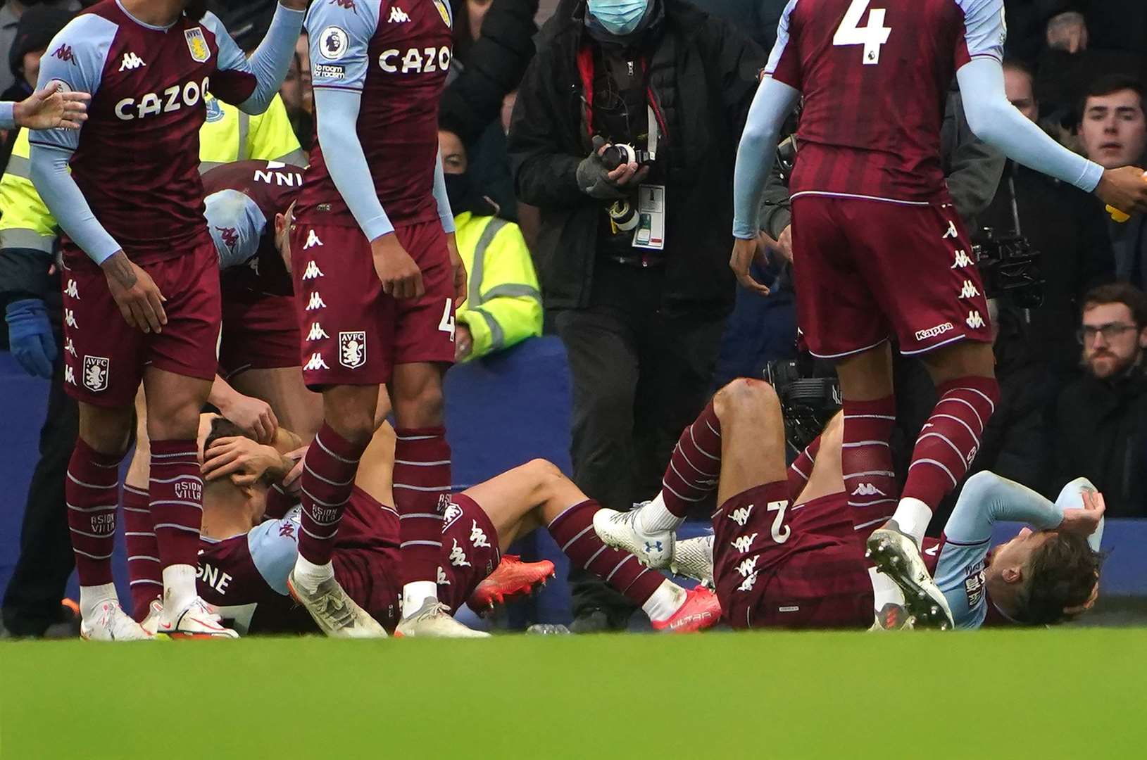 The players went down after the incident as Aston Villa celebrated a goal in the first half of the match (PA)