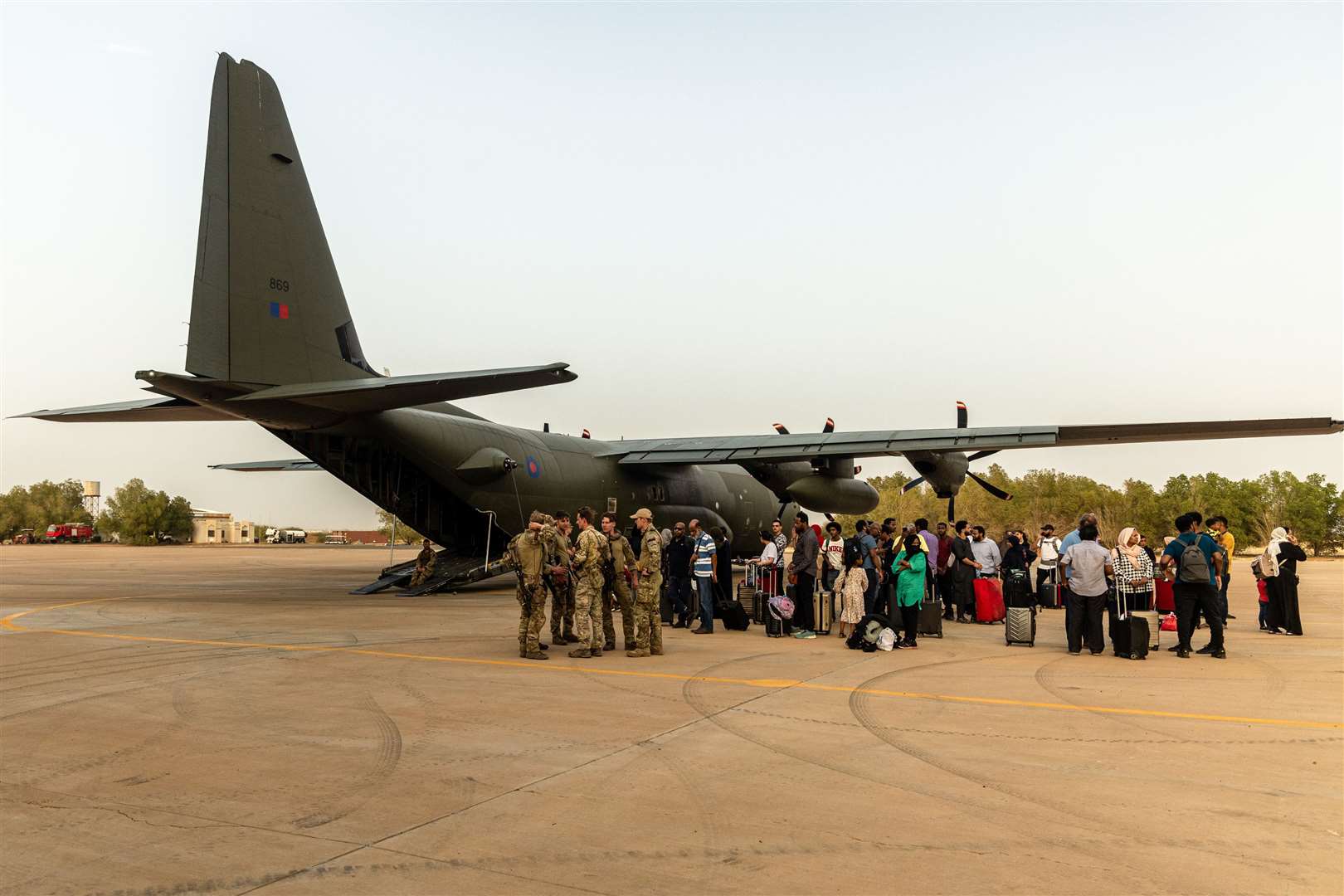 British nationals about to board an RAF aircraft at RAF Akrotiri in Cyprus on Wednesday after being evacuated from Sudan (Ministry of Defence/PA)