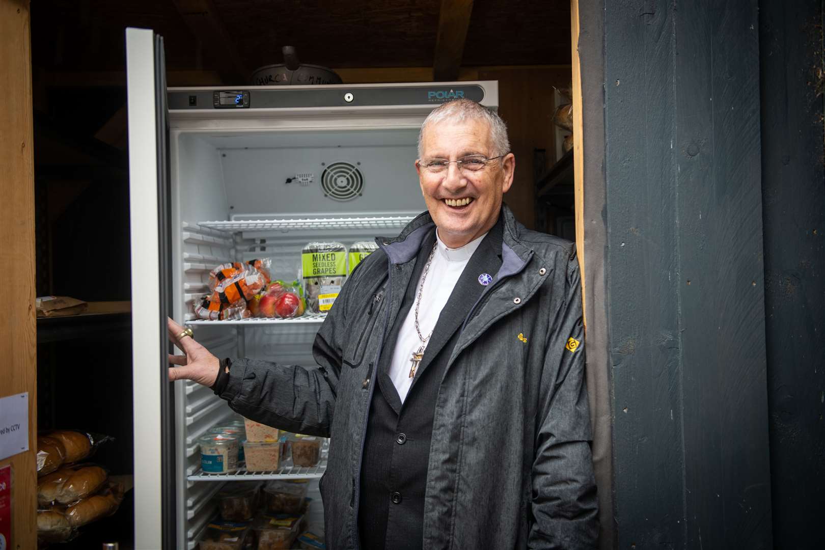 Moderator of the Church of Scotland General Assembly, Rt Rev Iain Greenshields, visits the community fridge at Culloden. Picture: Callum Mackay.