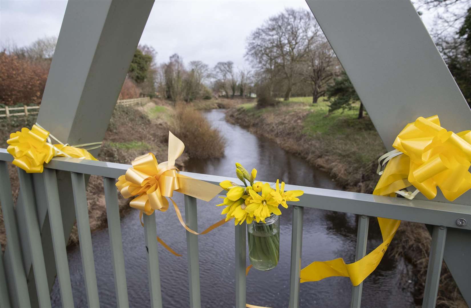 Flowers,and ribbons on a bridge over the River Wyre in St Michael’s (Jason Roberts/PA)