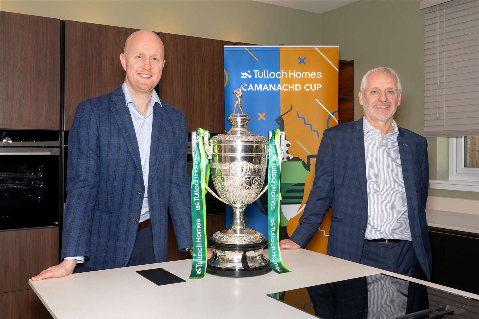 Kieran Graham, Tulloch Commercial Director and Sandy Grant, Tulloch Homes Managing Director with the Tulloch Homes Camanachd Cup