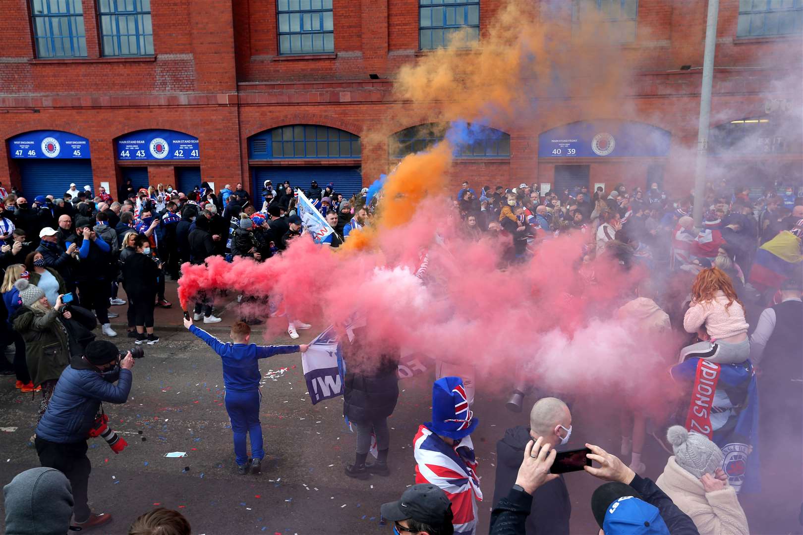 Fans celebrate after Rangers win the Scottish Premiership title (Robert Perry/PA)