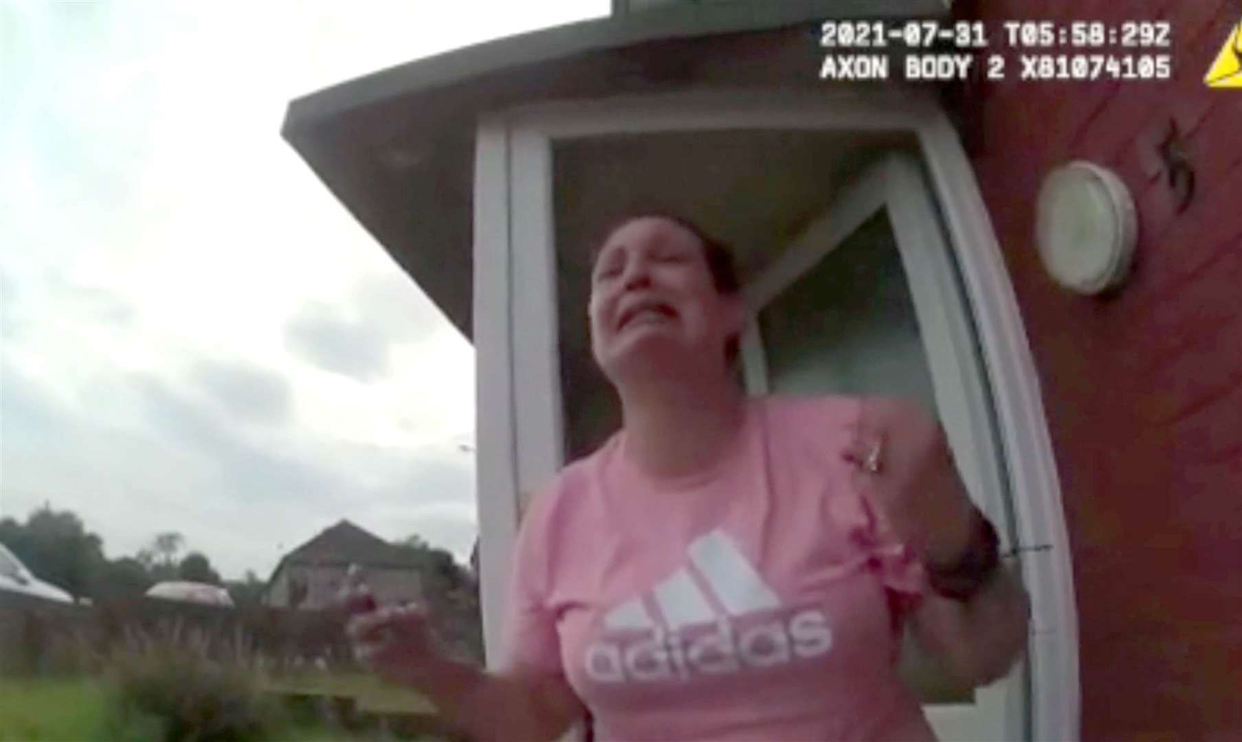 Police body-worn video footage of Angharad Williamson, 31, crying crocodile tears on the doorstep of her home in Sarn, Bridgend (South Wales Police/PA)