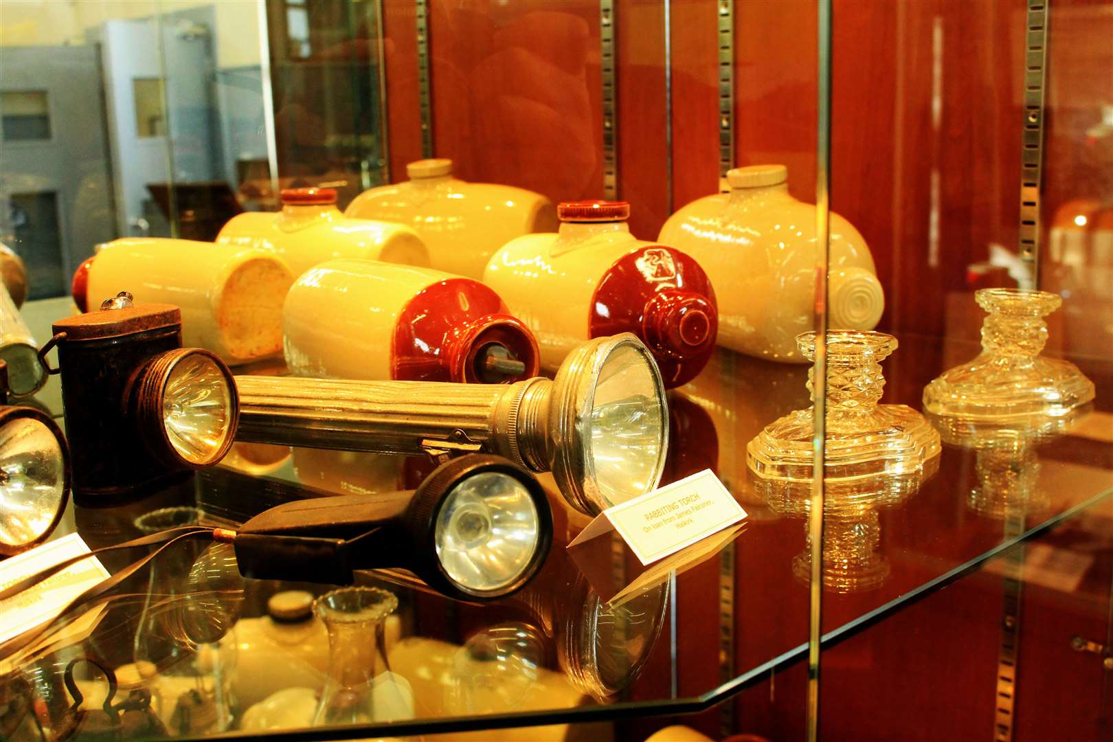 A rabbiting torch is among the items in this display case.