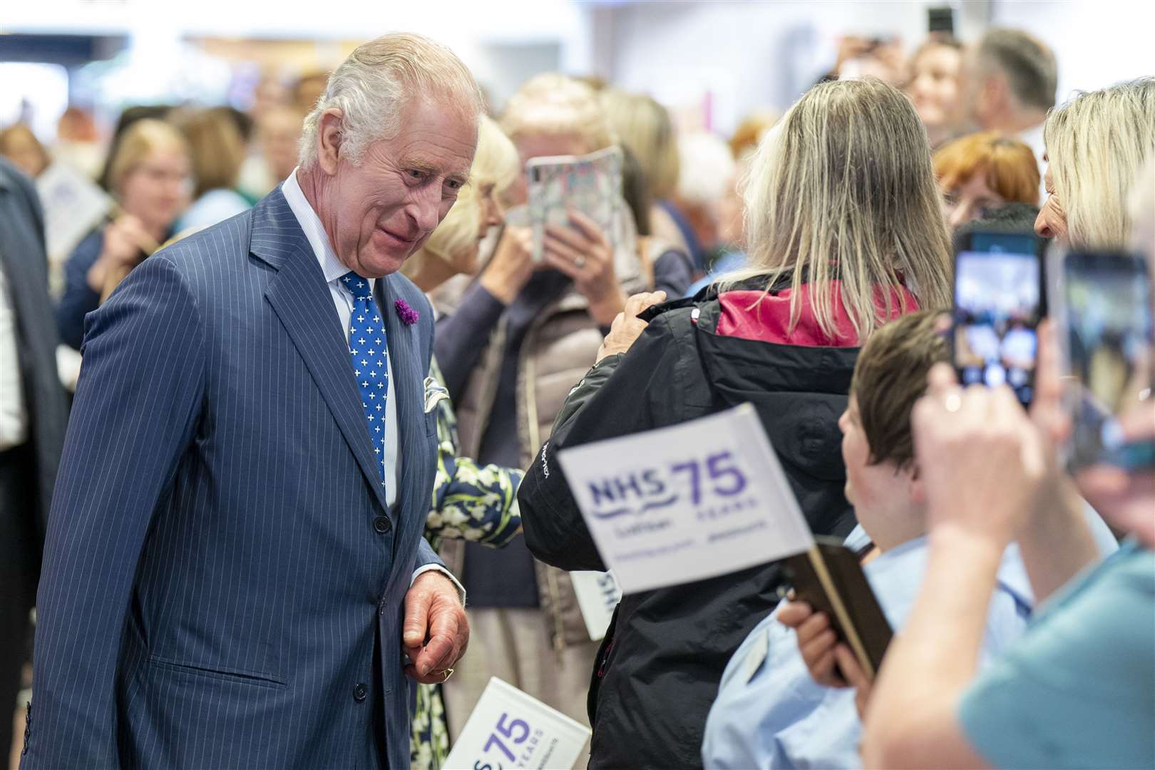 Charles is spending the week in Scotland and visited the Royal Infirmary of Edinburgh to celebrate 75 years of the NHS (Jane Barlow/PA)