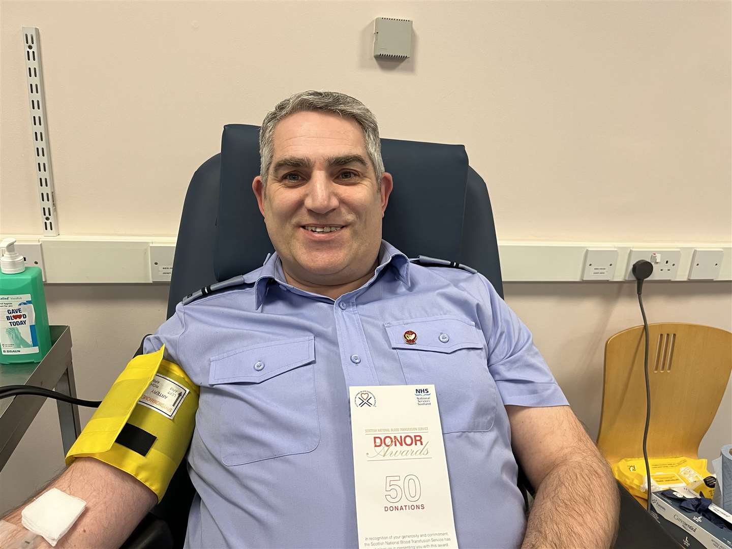 Air cadet commanding officer Neil Jack making his 50th blood donation in Inverness.