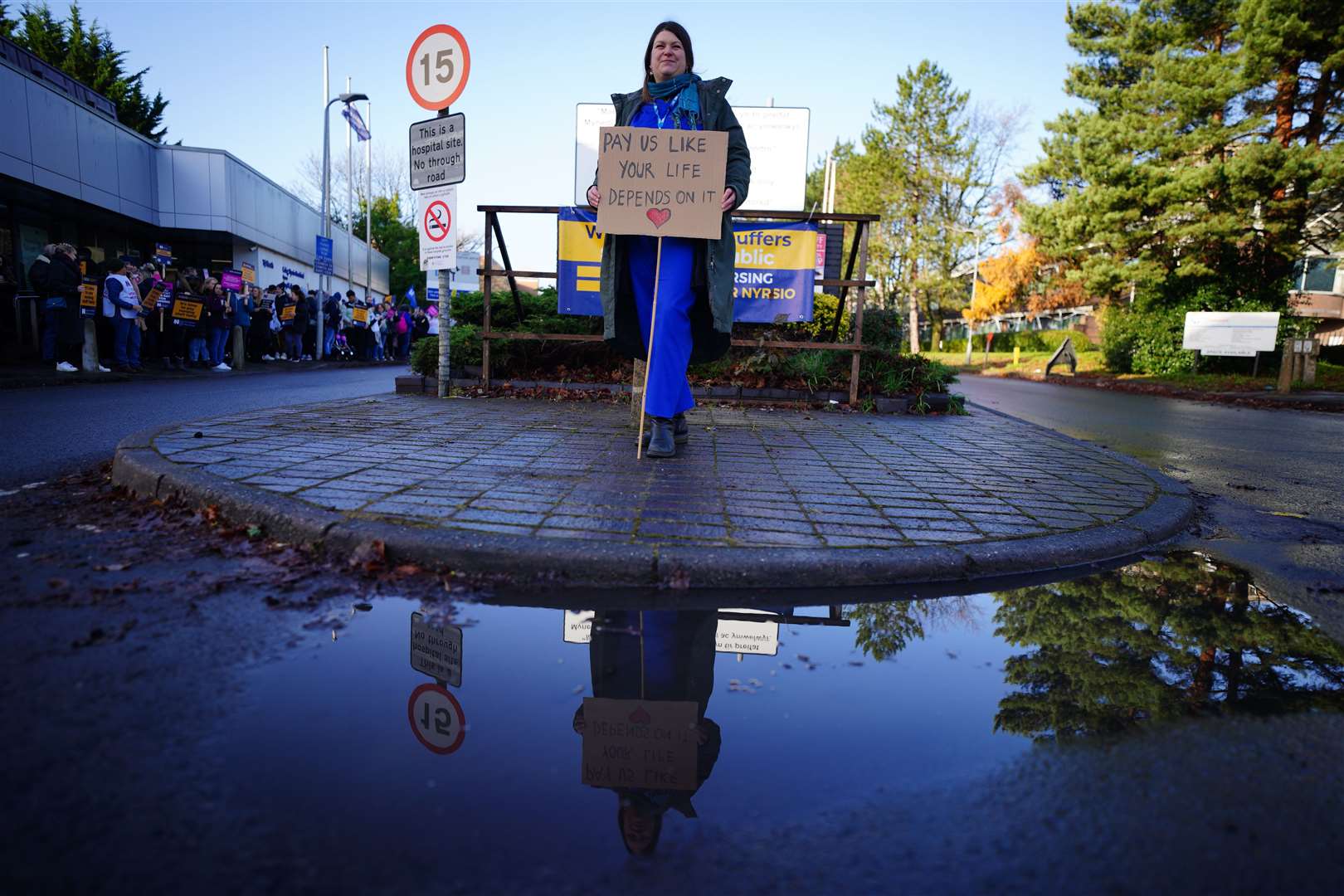 Madelaine Watkins joins members of the Royal College of Nursing on the picket line outside at Cardiff University Hospital earlier this week (PA)