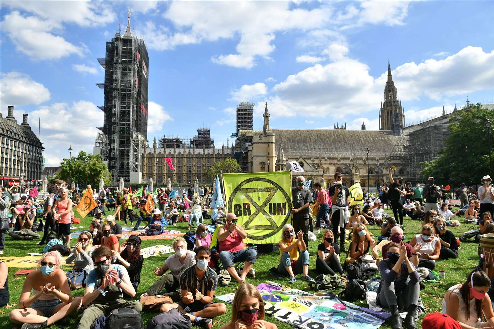 Extinction Rebellion protesters sitting outside The Houses of Parliament (Dominic Lipinski/PA)