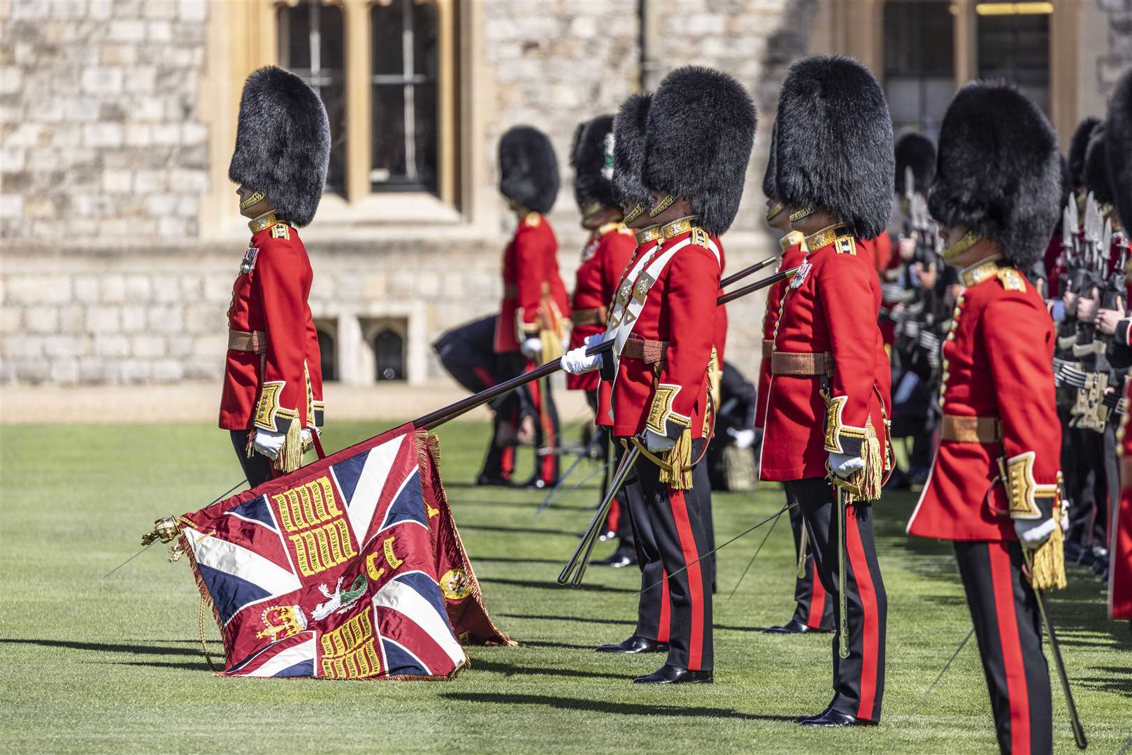 The new regimental colours of the 1st Battalion Irish Guards are paraded in the Quadrangle of Windsor Castle (Richard Pohle/The Times/PA)