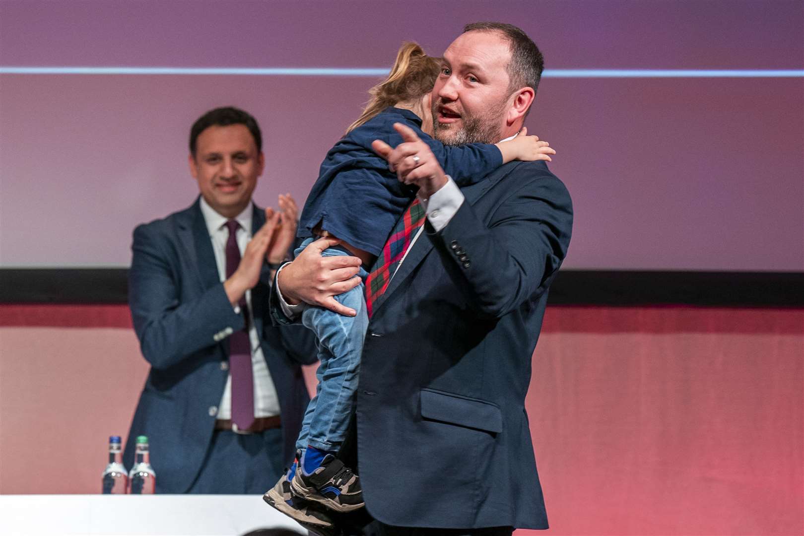 Shadow secretary of state for Scotland Ian Murray receives a hug from his daughter Zola at the end of his speech (Jane Barlow/PA)