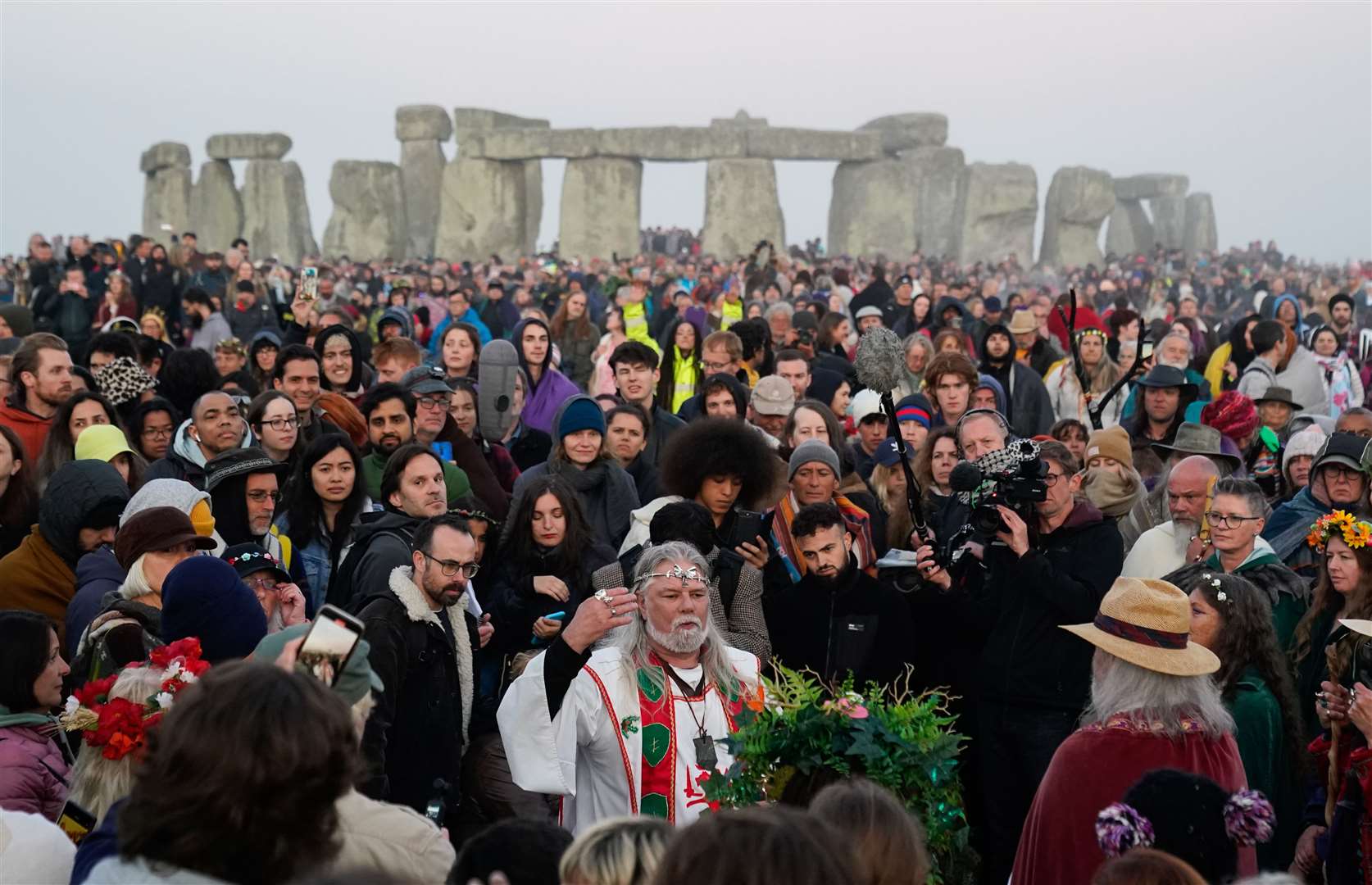 Eco-campaigner and neo-Druid Arthur Uther Pendragon joins people as they gather at the Heel Stone (Andrew Matthews/PA)