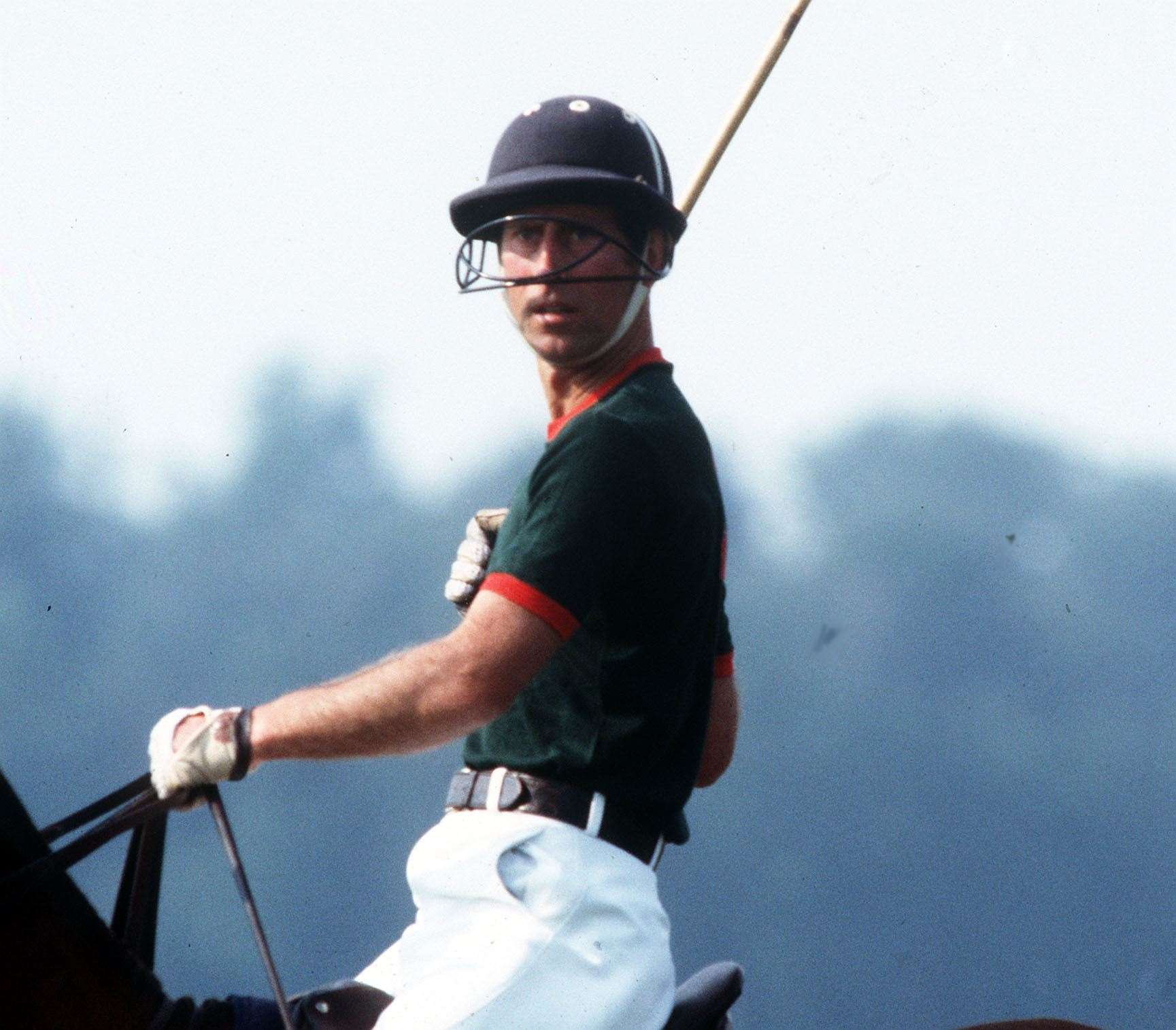 Charles playing polo in 1984 (PA)