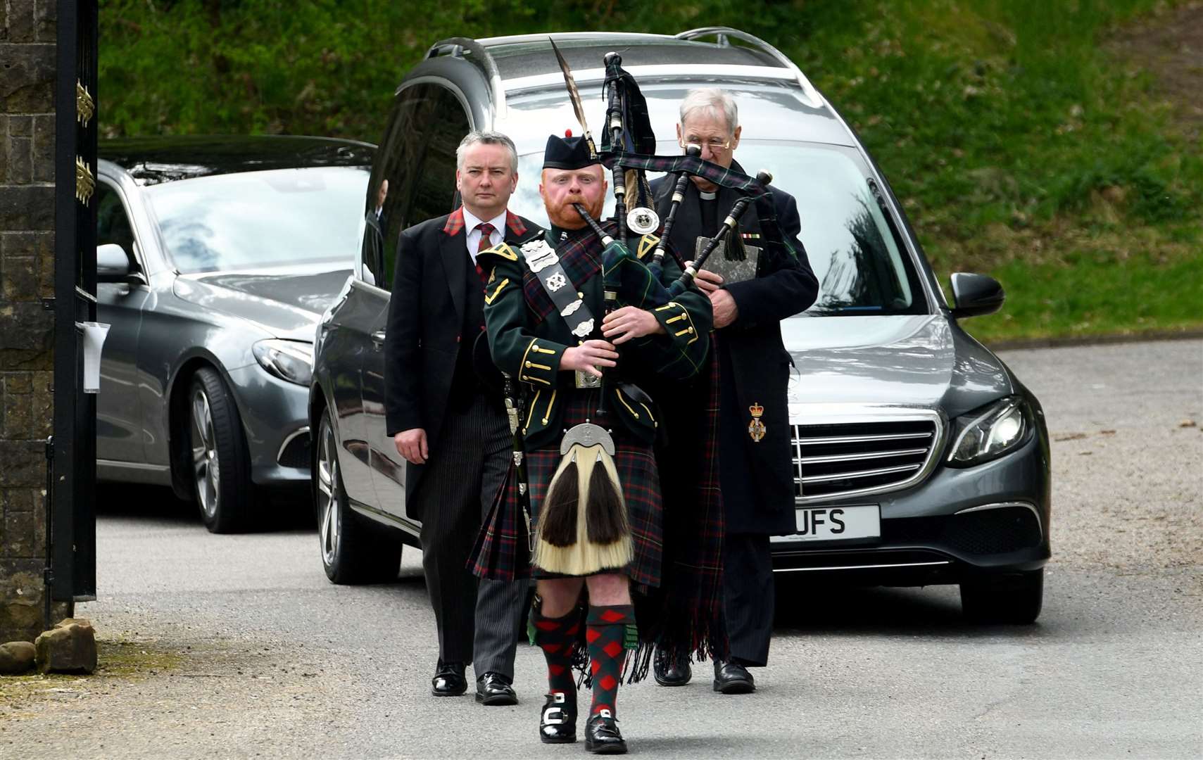Piper Norrie Gillies leads the funeral procession. Pictures: James Mackenzie.