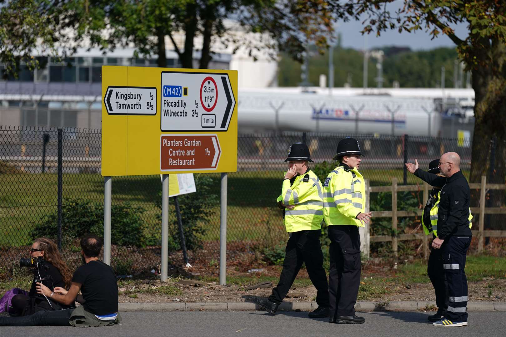Police officers at the Just Stop Oil protest which blocked the entrance to the Kingsbury Oil Terminal near Birmingham on September 14 (Joe Giddens/PA)