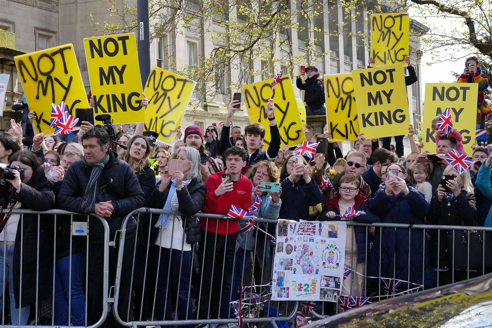 Protesters wait for the arrival of King Charles III and the Queen Consort for their visit to Liverpool Central Library (Jon Super/PA)