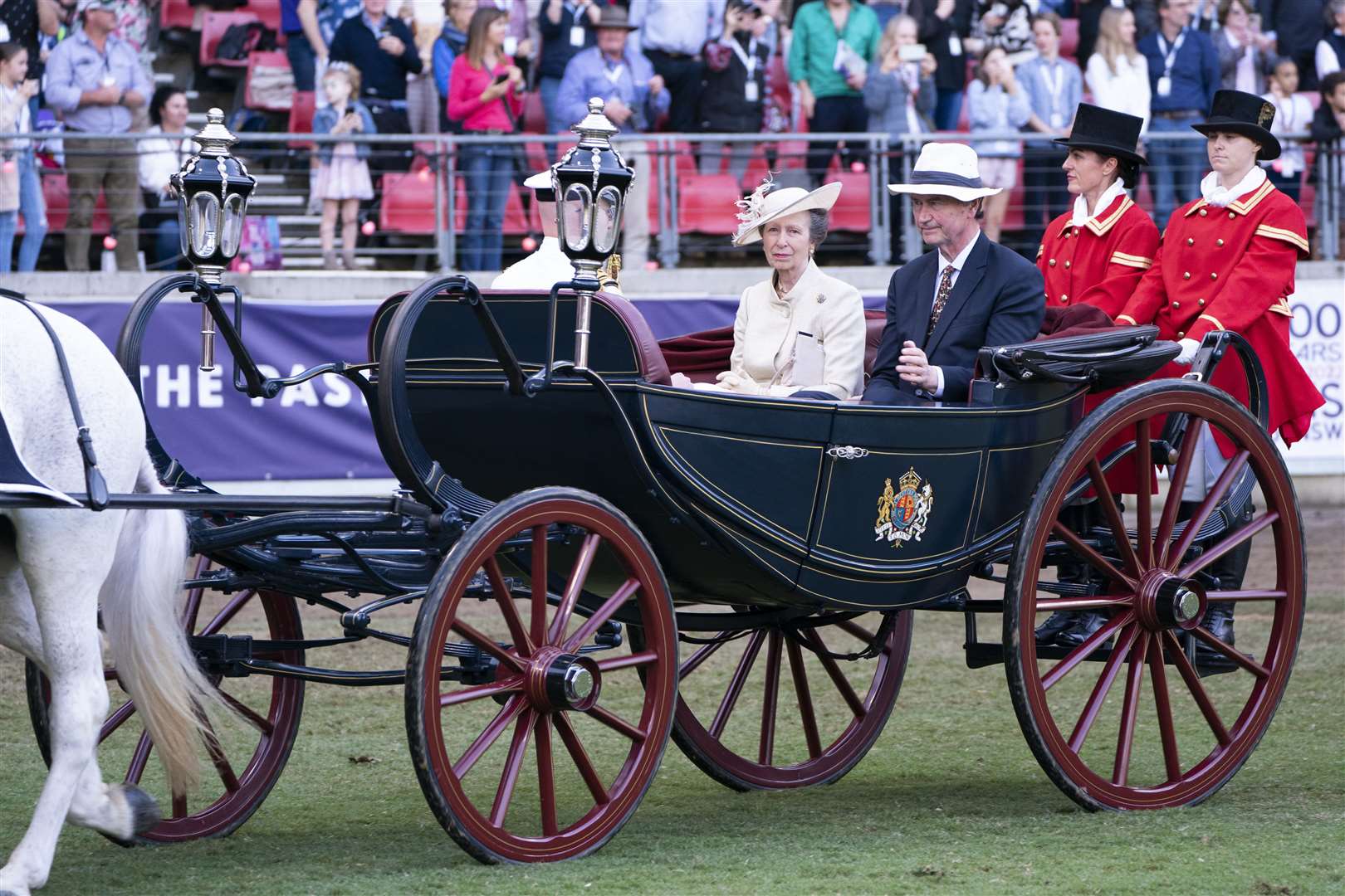 The Princess Royal and Vice Admiral Sir Tim Laurence ride in a horse-drawn caleche, which carried the Queen, the Duke of Edinburgh, the Prince of Wales and the Princess Royal in 1970, during the opening ceremony (Kirsty O’Connor/PA)