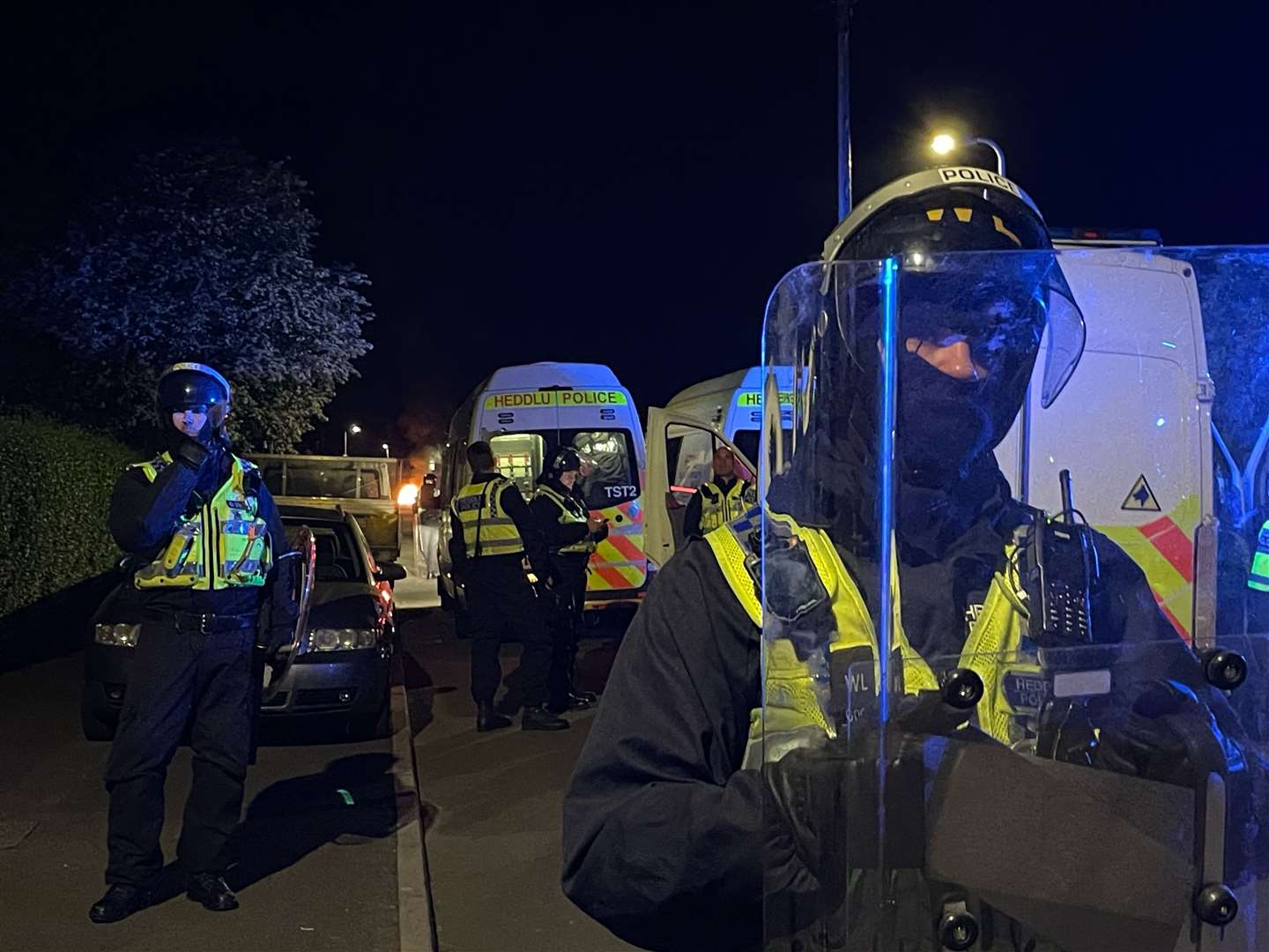 Police officers on Howell Road in Cardiff on Monday night (PA)