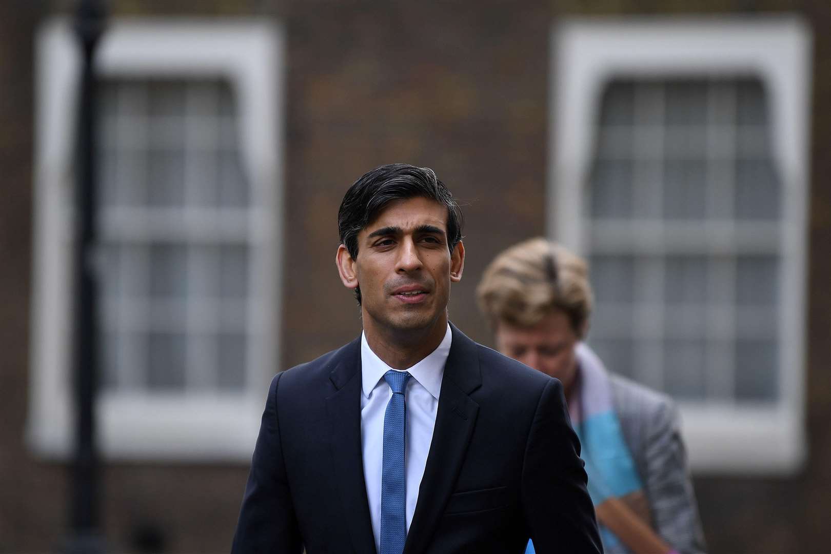 Britain's Chancellor of the Exchequer Rishi Sunak leaves Downing Street in central London on April 6, 2020. - British Prime Minister Boris Johnson spent the night in hospital after being admitted for tests following 10 days of persistent symptoms of coronavirus, but the government insisted today he remained in charge. (Photo by DANIEL LEAL-OLIVAS / AFP) (Photo by DANIEL LEAL-OLIVAS/AFP via Getty Images).