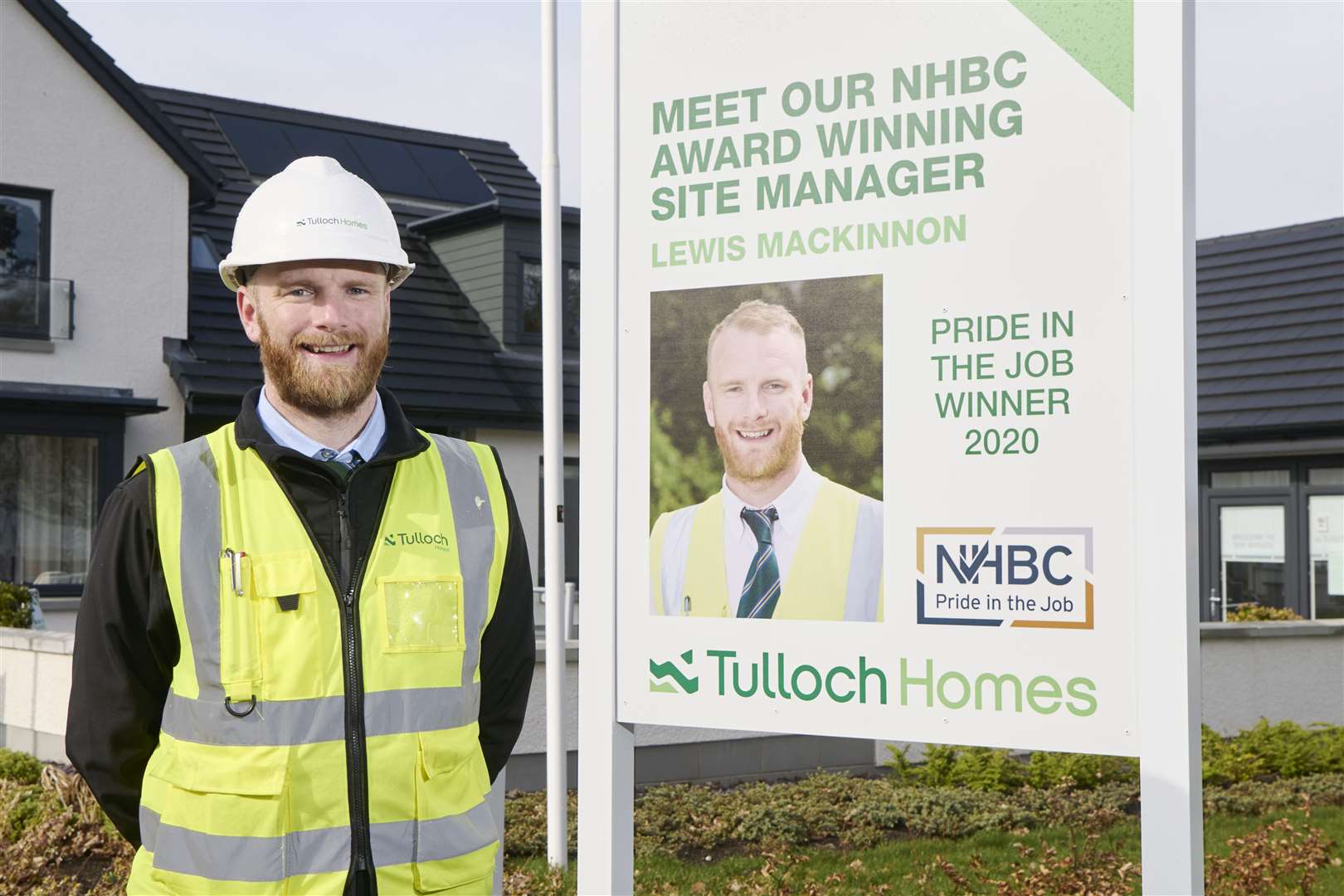 Site manager Lewis Mackinnon with a sign flagging up his award success.