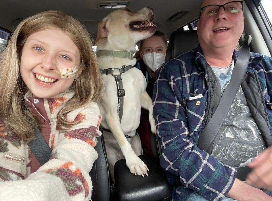 Rachel on a trip with dad James and her beloved dog Ollie.