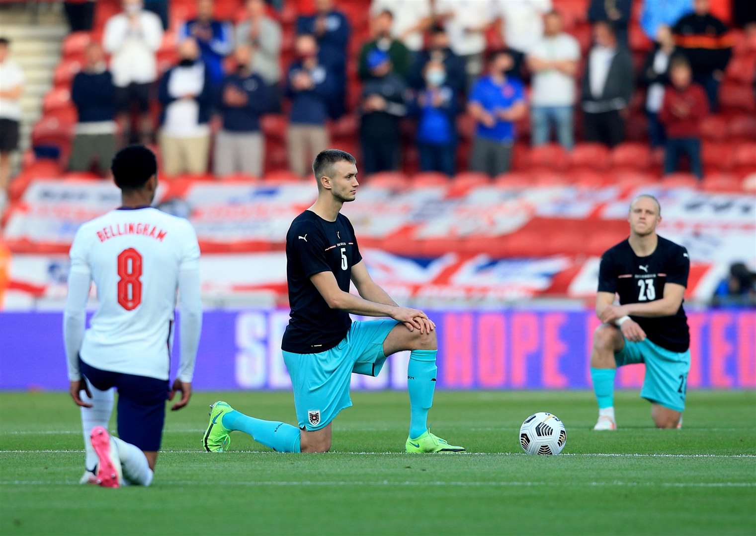 Players take the knee before the England v Austria friendly (Lindsey Parnaby/PA)