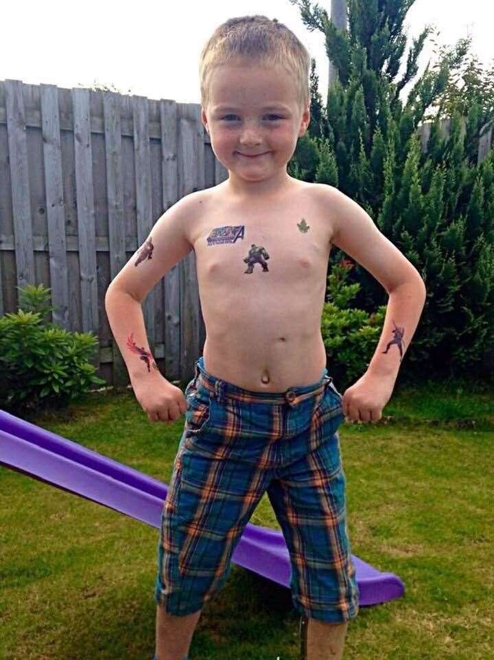 Hamish Hey showing off his fake Avengers tattoos. He was a massive fan.