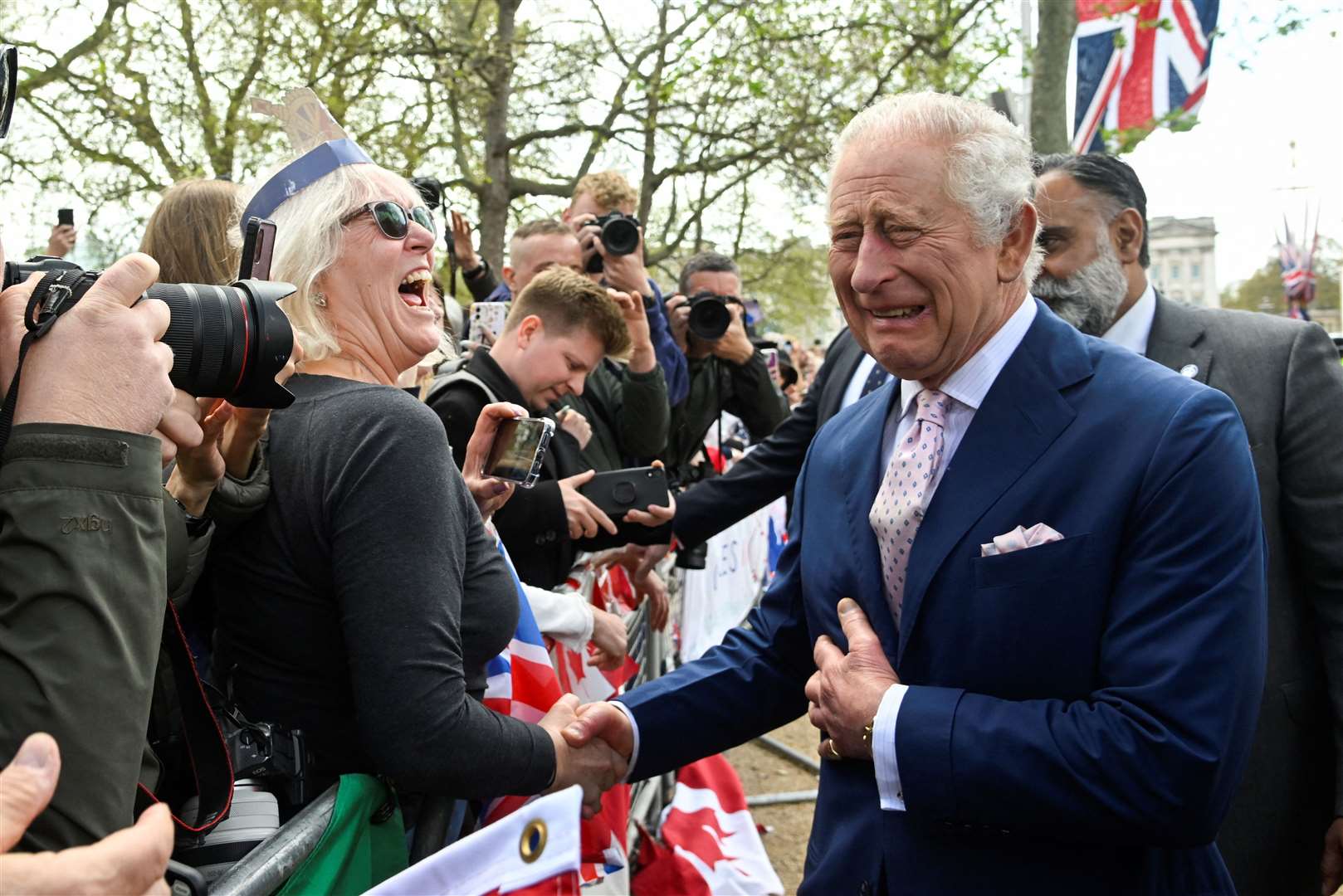 The King jokes with a well-wisher in The Mall (Toby Melville/PA)