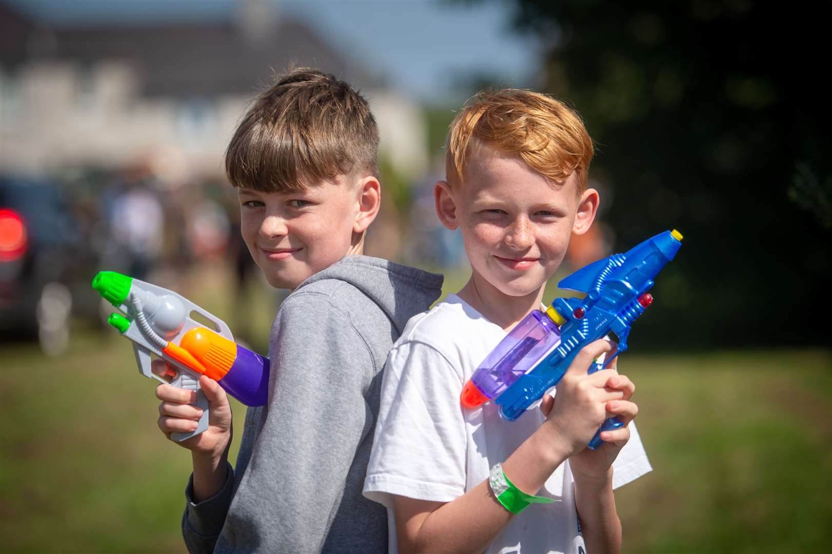 READY, aim, fire... Two youngsters enjoy the fun day...