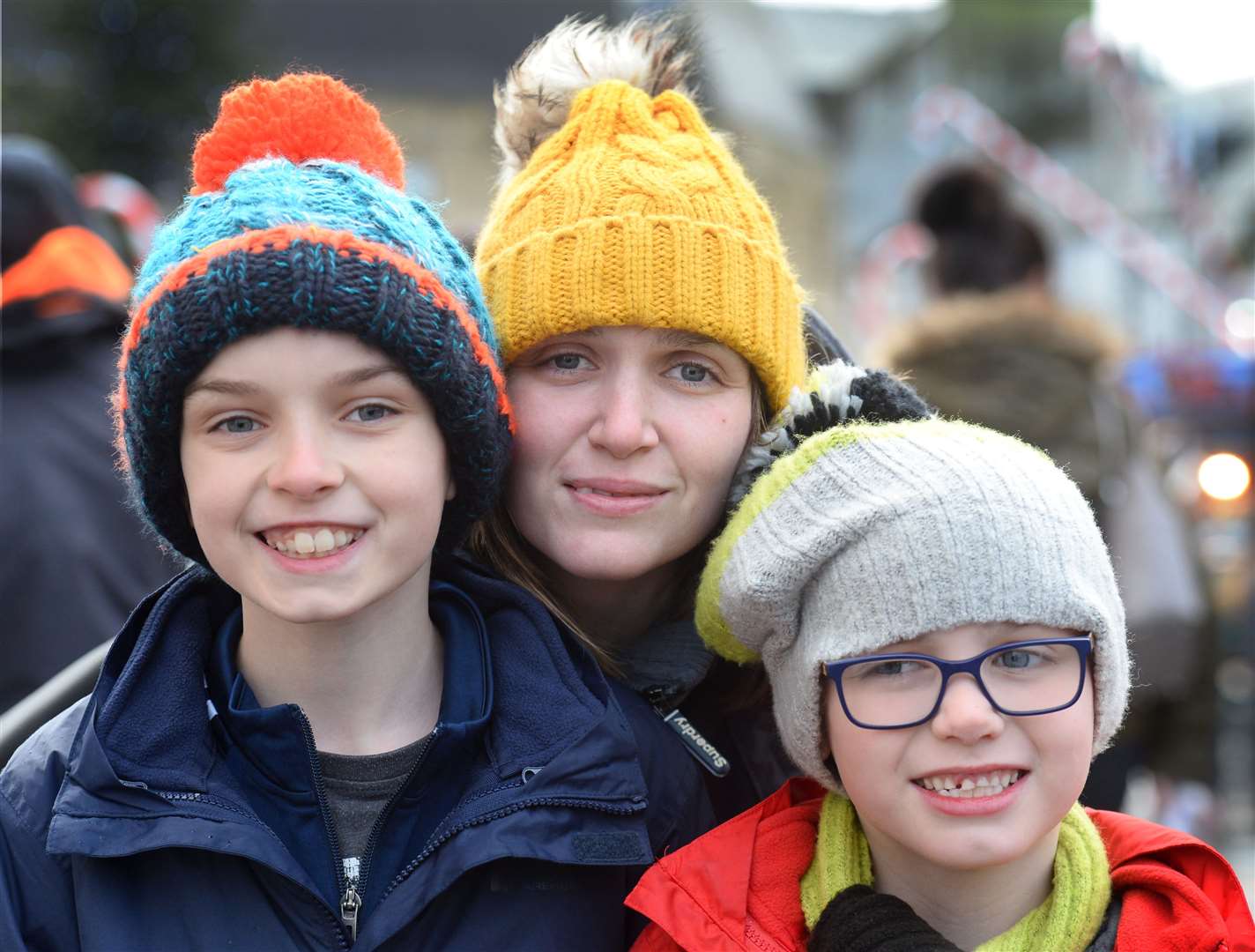 Joe Mackay, Rachael Moore and Zach Kerr snuggle up to keep cold out. Picture: Gary Anthony. Image No.