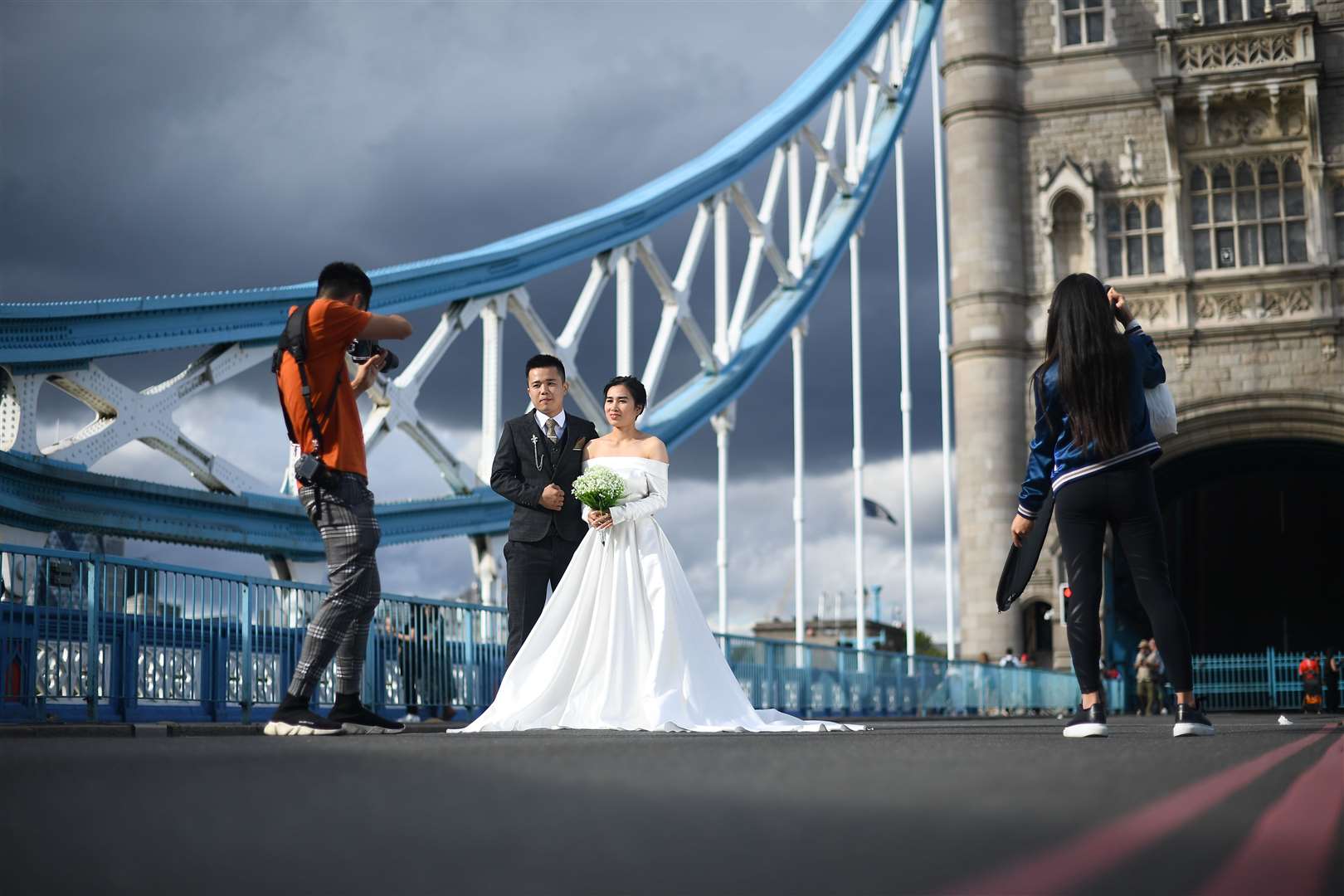 Tower Bridge served as an impressive backdrop for the happy couple (Victoria Jones/PA)