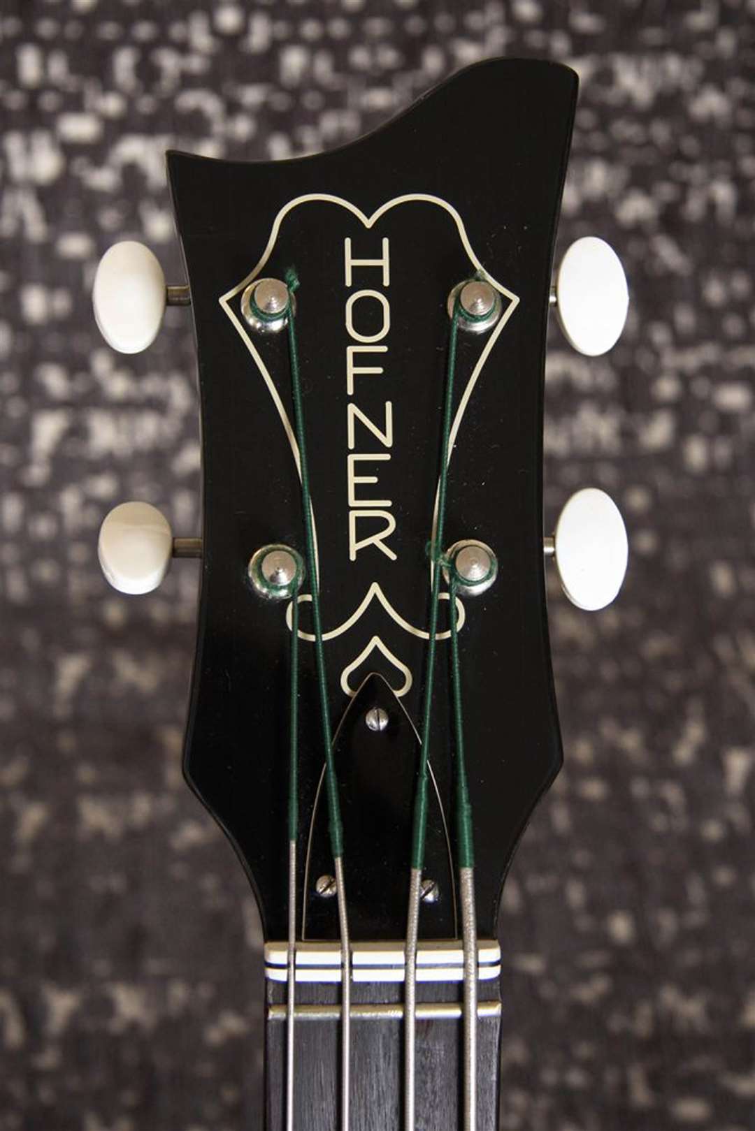 A detail from an replica of Sir Paul McCartney’s original Hofner bass guitar which shows the brand’s name written vertically down the guitar (Guncotton Guitars/PA)