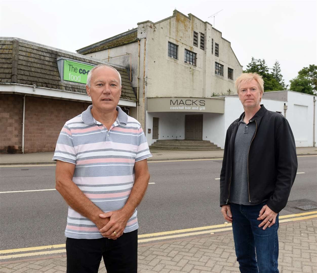 BID director Bob Ferenth and BID chairman Peter Gibson outside the former cinema in Nairn, which forms part of the Co-op building.