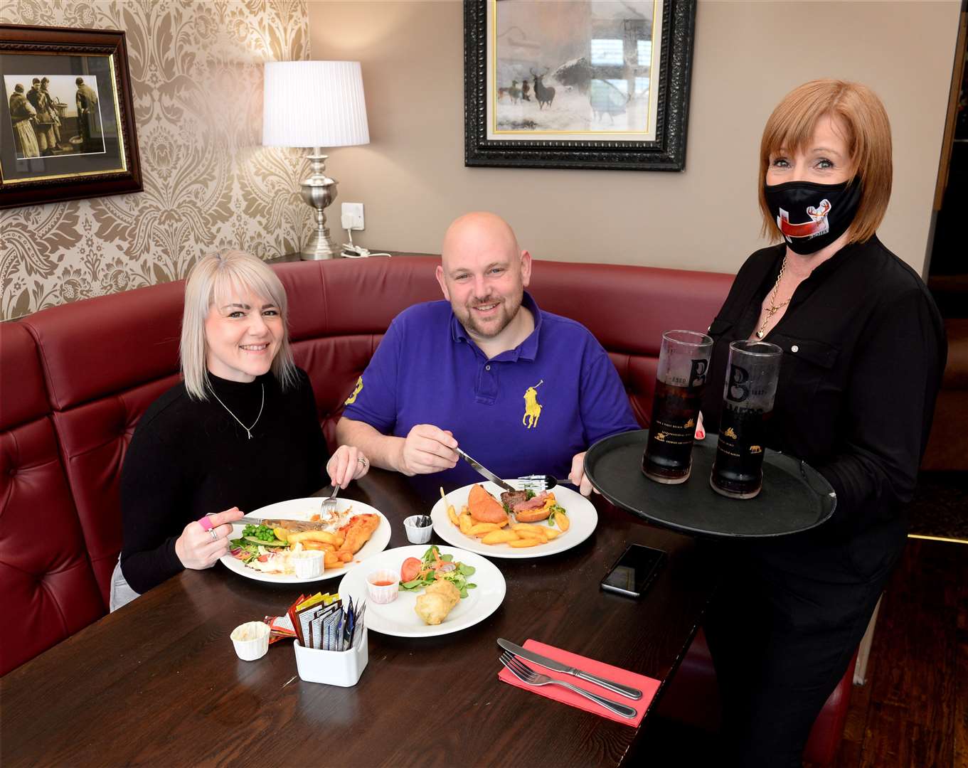Alison Banks and Marc Gardiner with Chieftain Hotel's Liz Lawson enjoy the Eat Out To Help Out scheme...Picture: Gary Anthony..