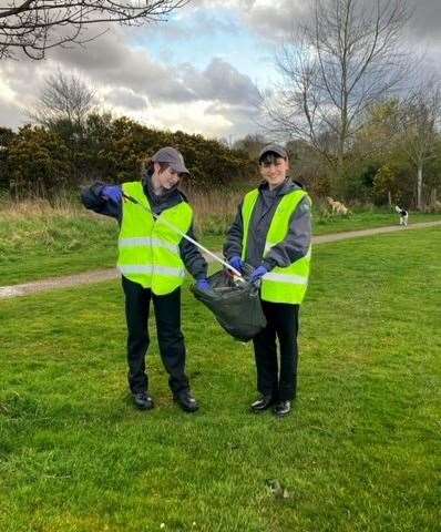 The young volunteers took to open spaces in Inshes to help clean up the local community. Picture: Police Scotland.