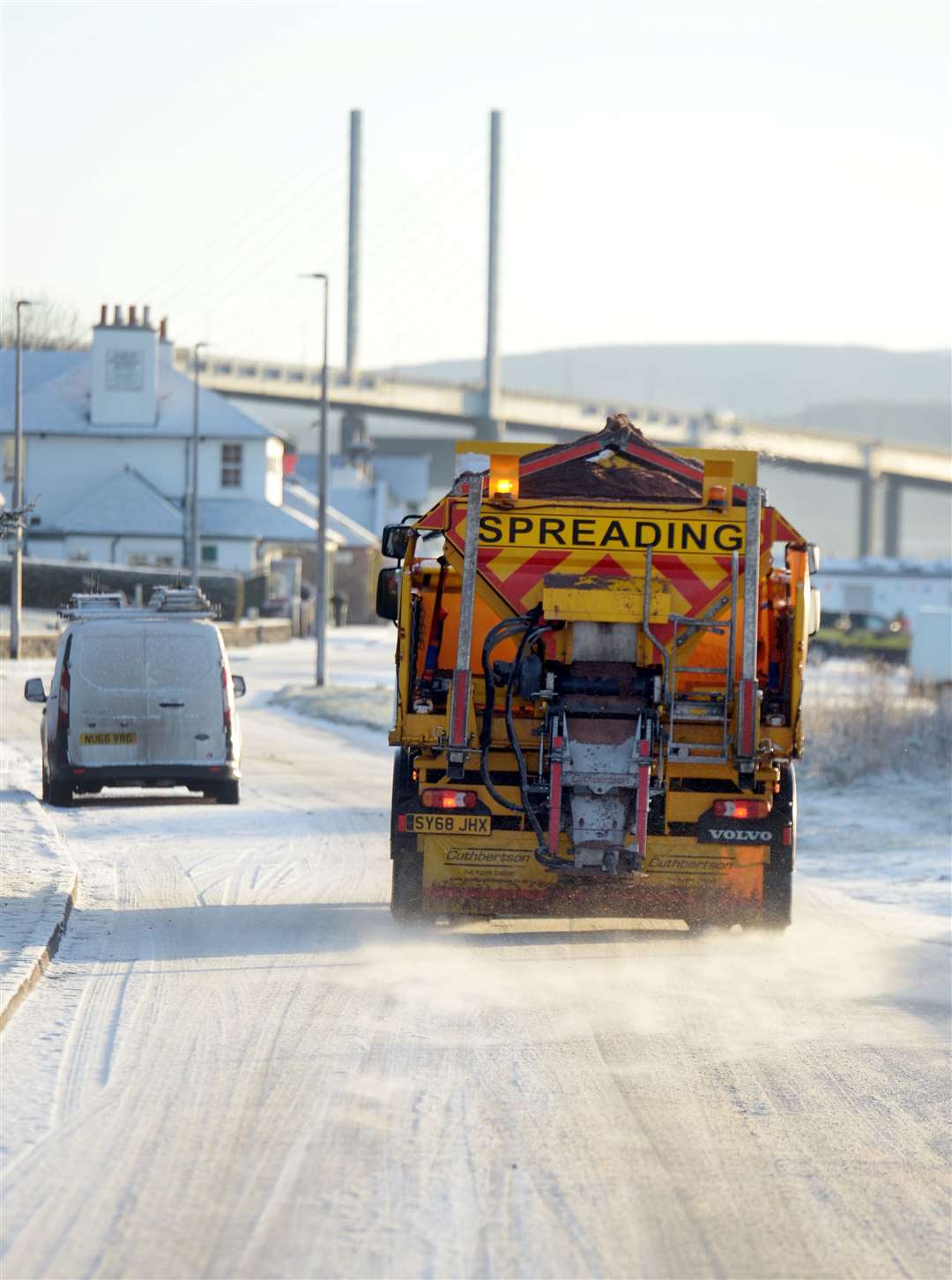 A wintry scene as gritter works near Inverness.