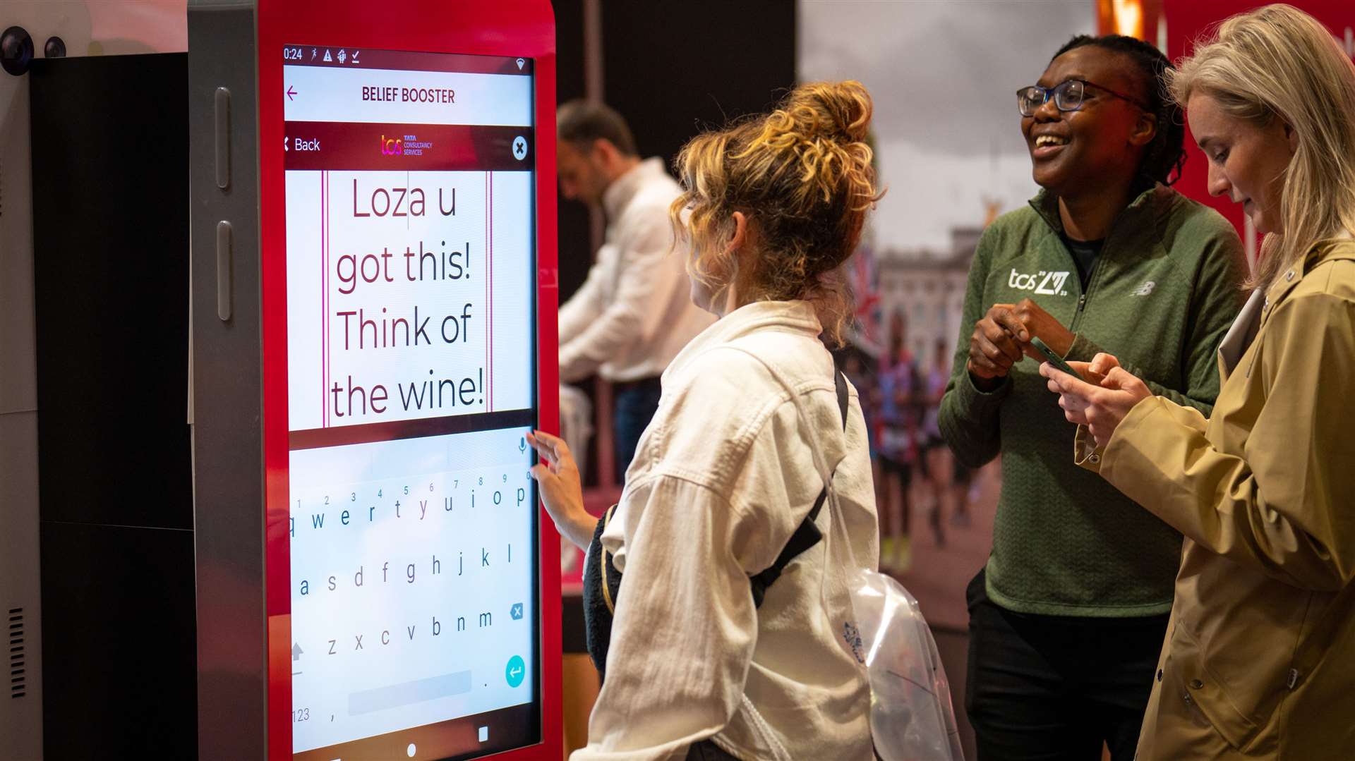 A supporter sends a Belief Booster personal message through the app at the TCS London Marathon running show at ExCel London (TCS/PA)