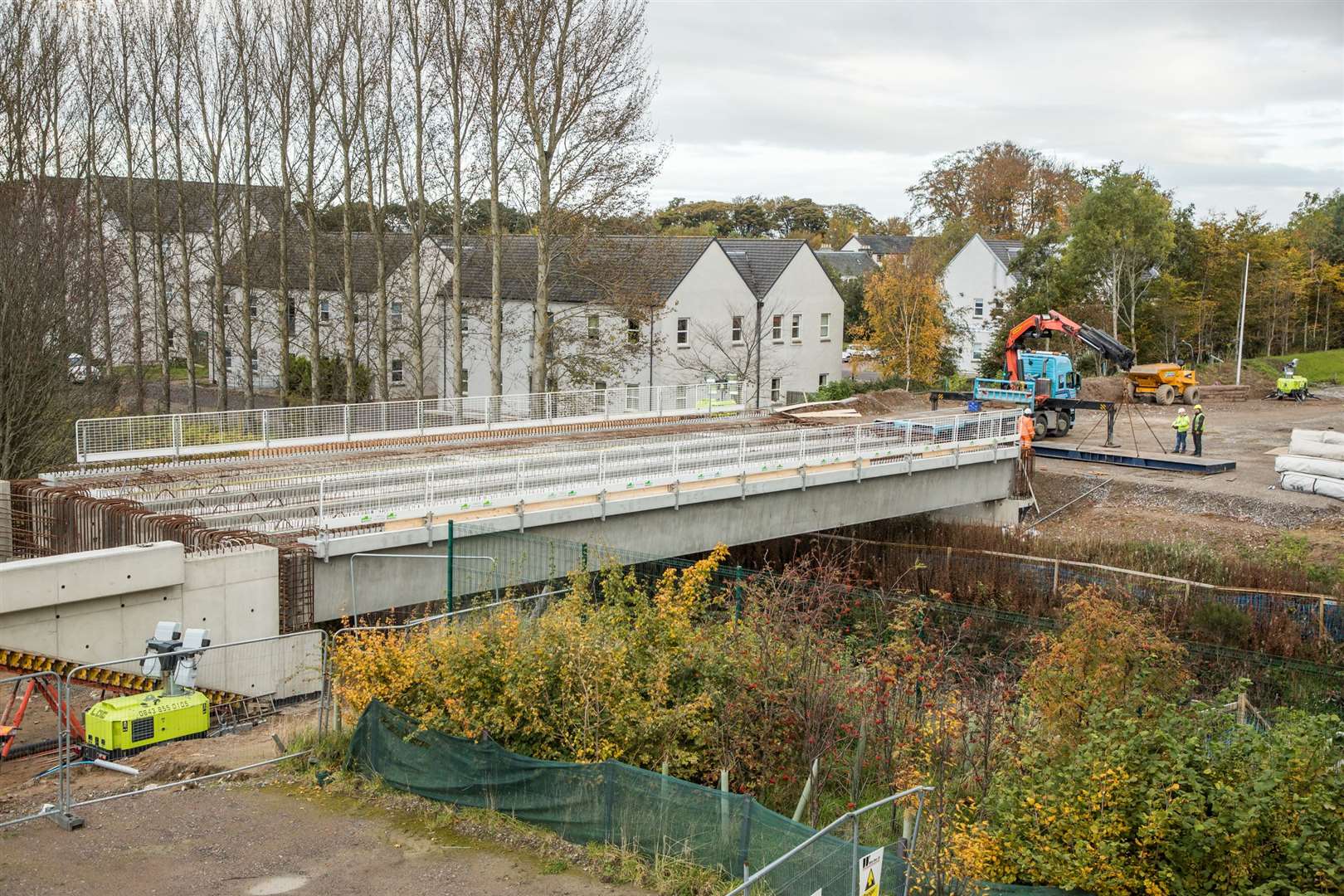 Contractors Will Brothers installs key beams during construction of the bridge to link Inverness Campus with the business and retail park.