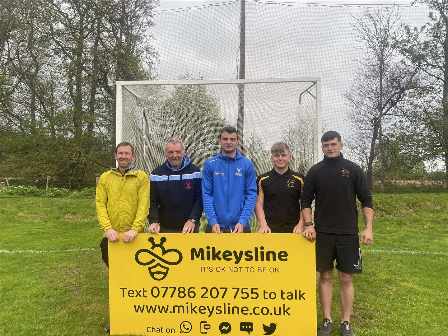 Caberfeidh Club is supporting Mikeysline with a banner at its grounds. Pictured (l-r) are Jodi Gorski, first team manager; Iain MacLean, club president; Blair Morrison, first team captain; and players Finlay Coleman and Kai McAuley.