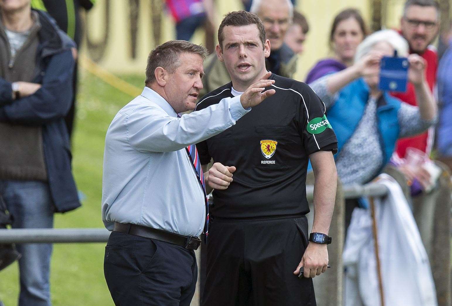 MSP Douglas Ross pictured here back in 2017 while refereeing Forres Mechanics v Inverness CT as then Caley manager John Robertson has a few words.
