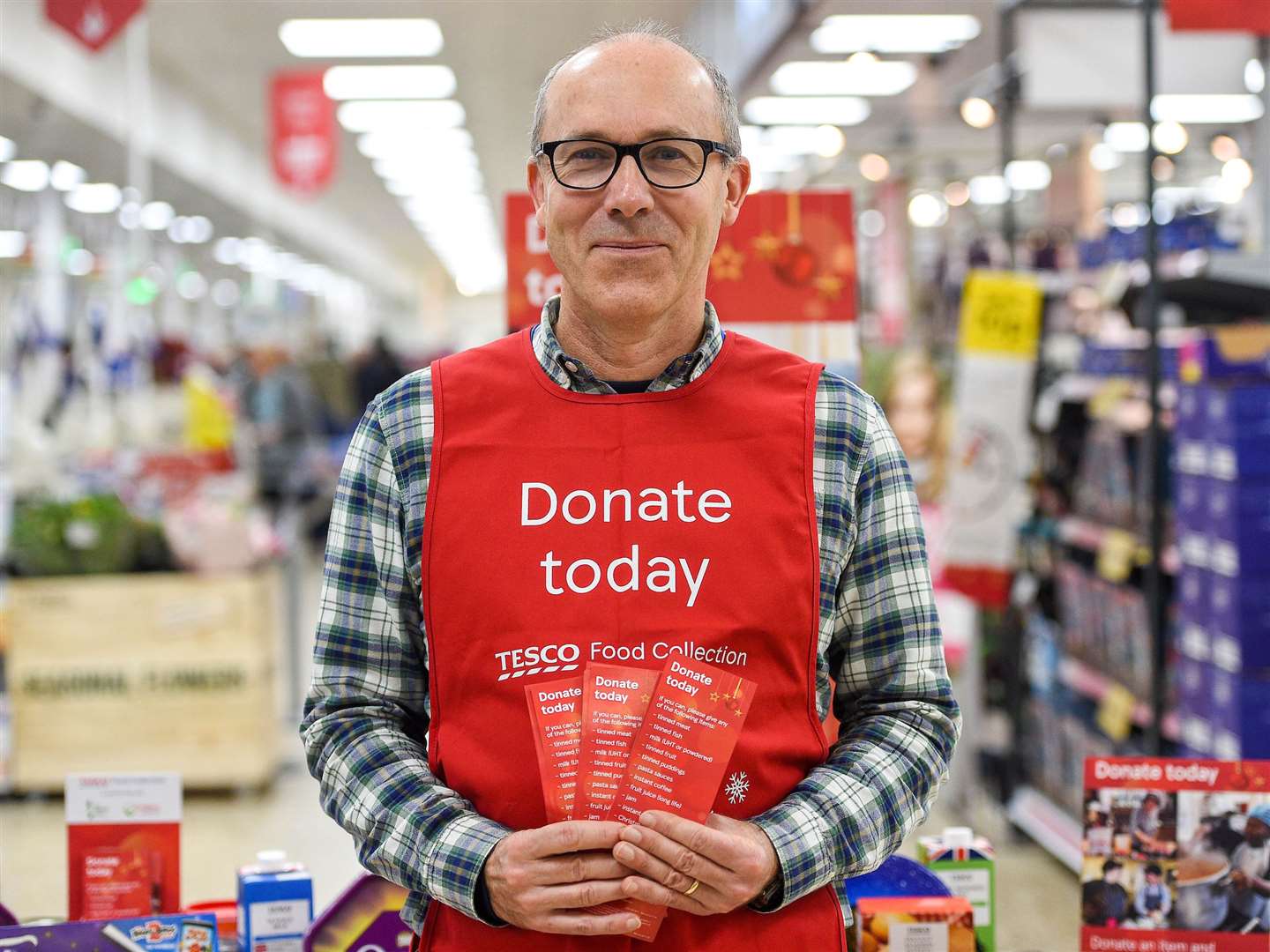 Tesco have launched an appeal for volunteers to help them give away food for Christmas.