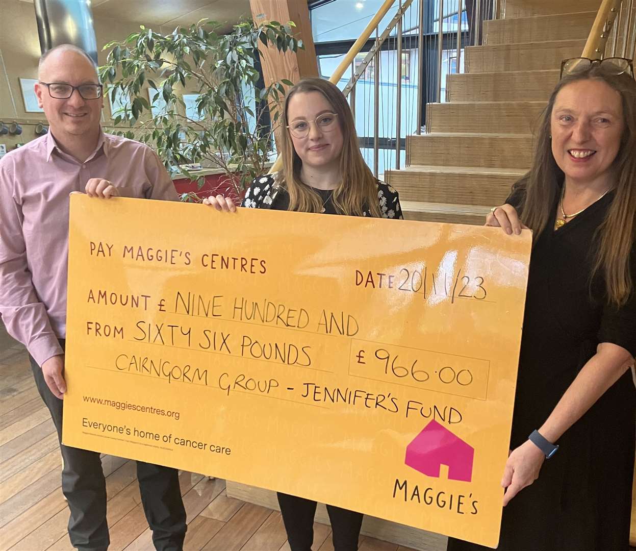 Chris Dowling from Jennifer’s Fund and the Cairngorm Group hands over a cheque for £966 to Claire Davis (centre) and Seonaid Green to fund children’s support groups at Maggie's Highland.