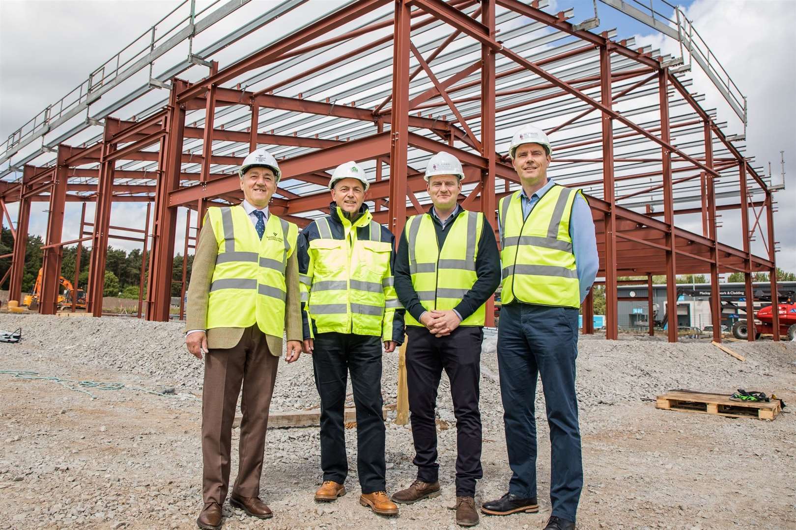 James Campbell of Inverness Airport Business Park (left) with Willie Gray, managing director of ARK Estates and contractor IBI Joiners' Brian Innes and Keith Duncan.