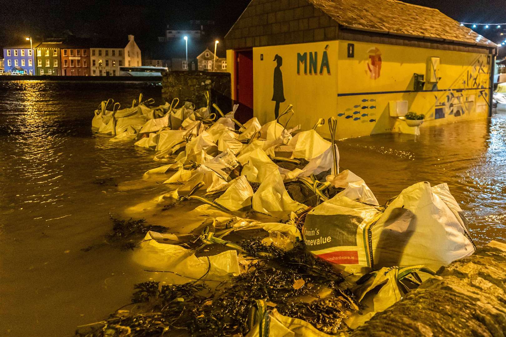 Sandbags are piled up in the town of Bantry, County Cork, which suffered flooding after Storm Barra (Andy Gibson / PA)